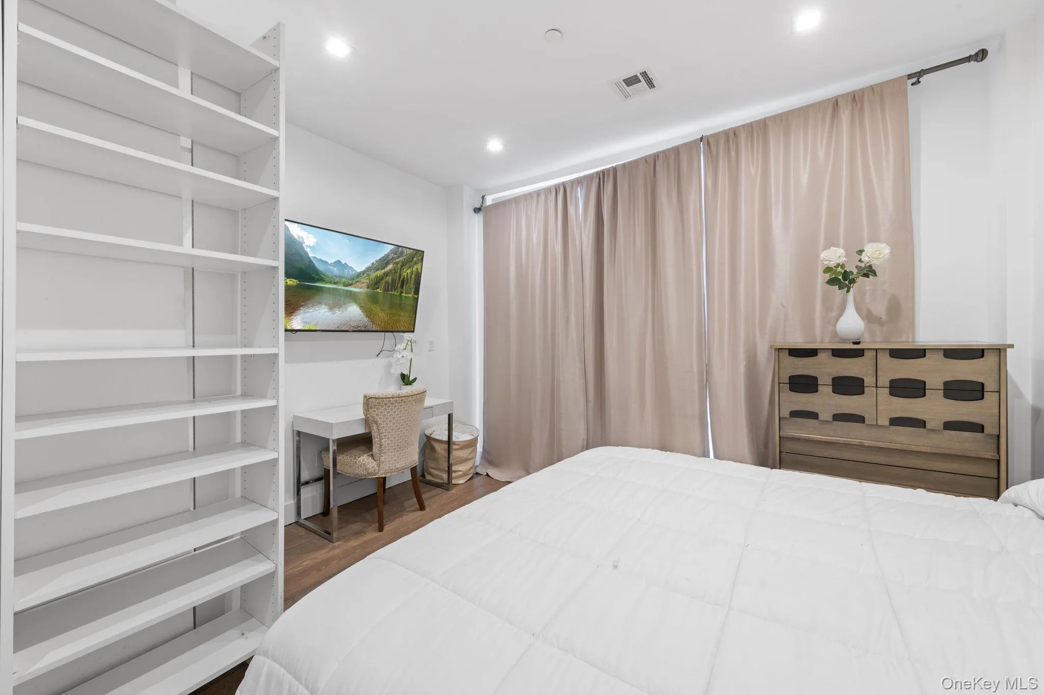 Bedroom featuring dark wood-style floors and recessed lighting Bedroom featuring dark wood-style floors and recessed lighting