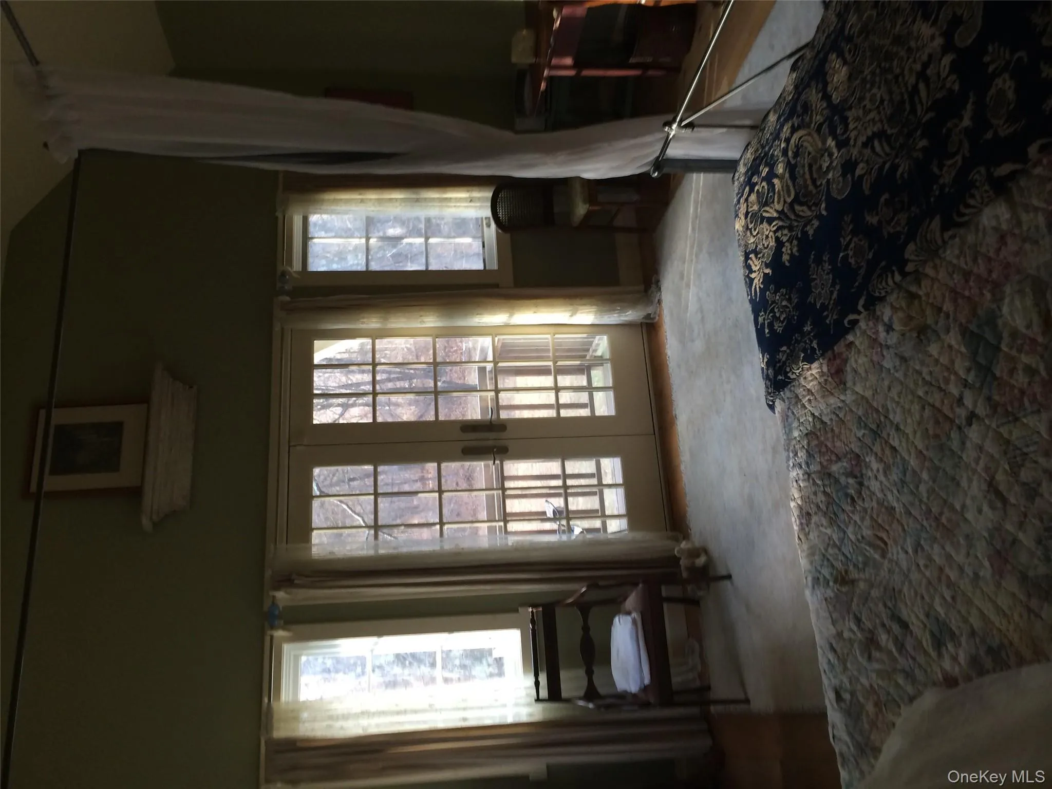 Primary Bedroom featuring french doors, access to outside, and vaulted ceiling Primary Bedroom featuring french doors, access to outside, and vaulted ceiling