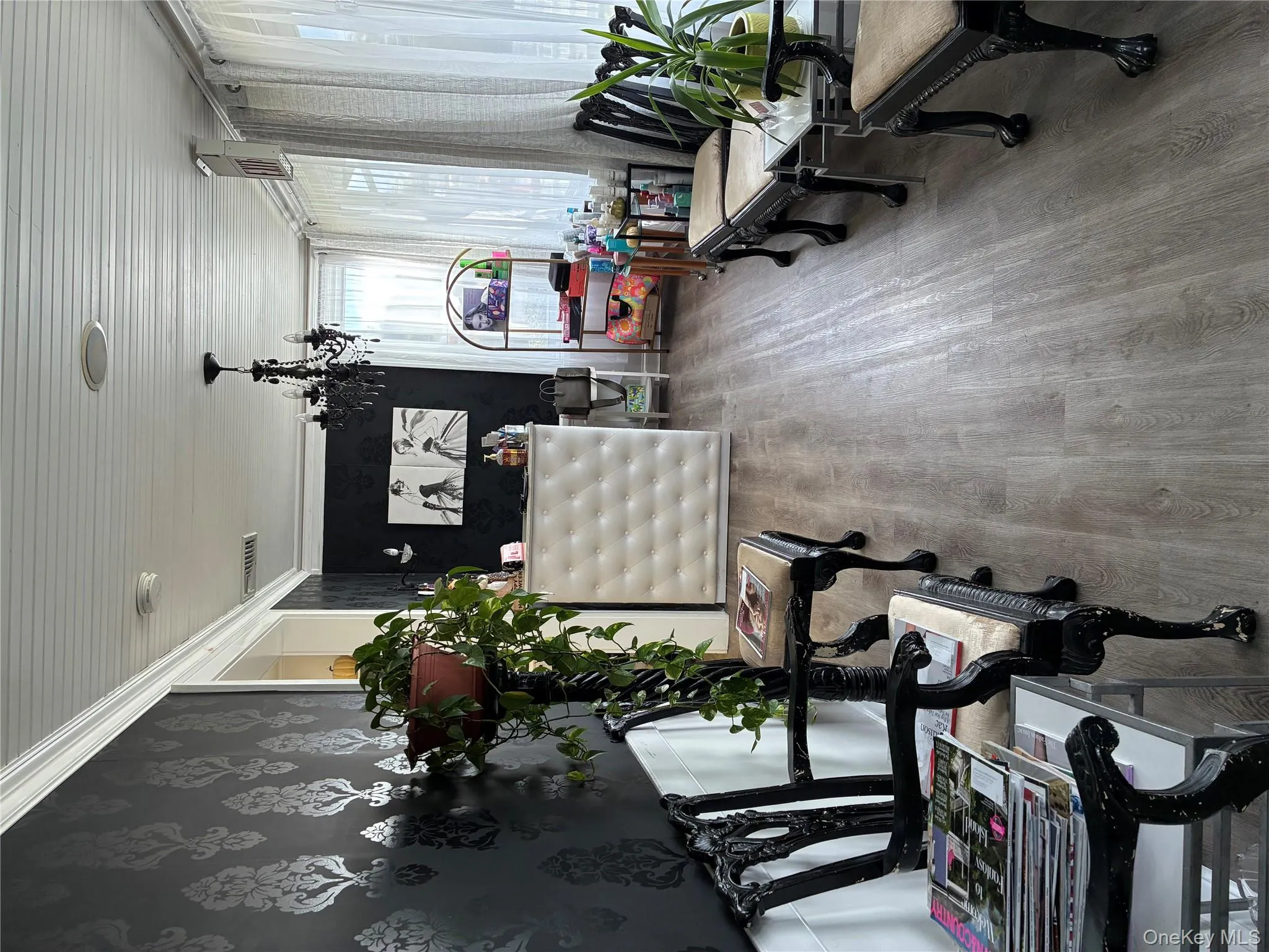 Sunroom / solarium featuring a chandelier Sunroom / solarium featuring a chandelier