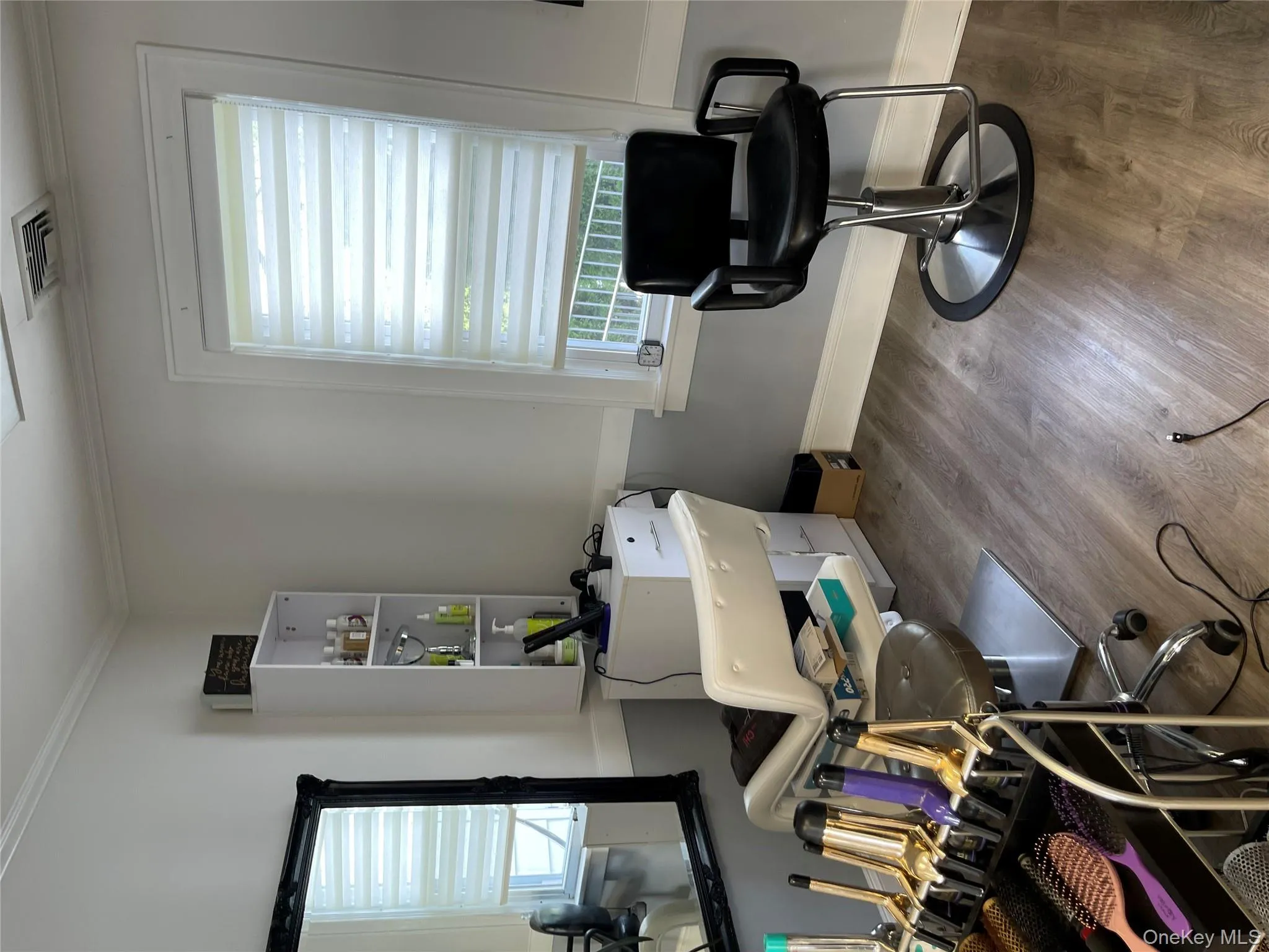 Office space featuring wood finished floors and ornamental molding Office space featuring wood finished floors and ornamental molding