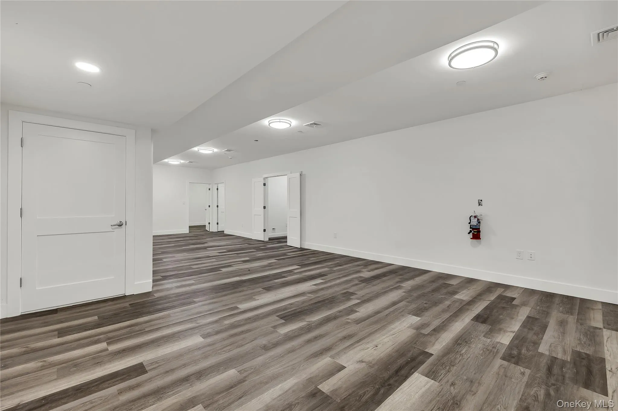 Finished below grade area featuring wood finished floors Finished below grade area featuring wood finished floors