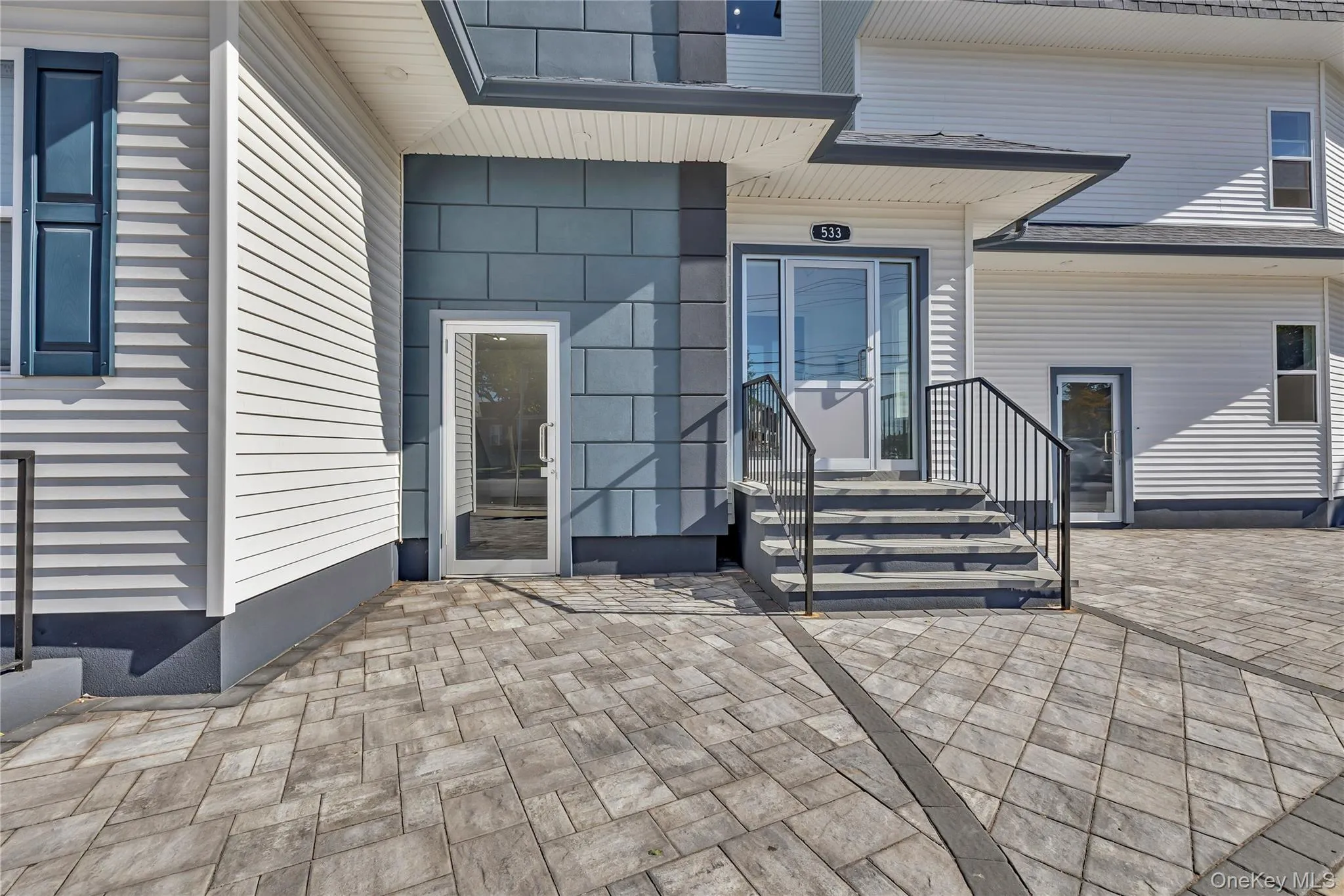 Doorway to property featuring a patio area Doorway to property featuring a patio area