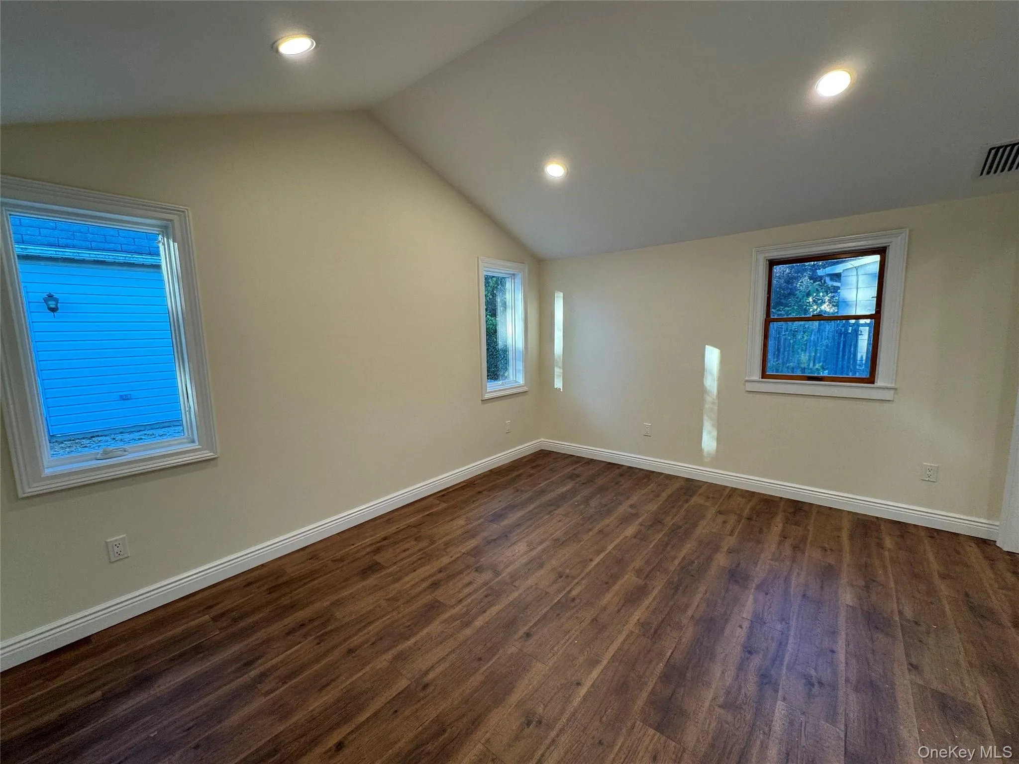 Bonus room with vaulted ceiling, dark wood-type flooring, healthy amount of natural light, and recessed lighting Bonus room with vaulted ceiling, dark wood-type flooring, healthy amount of natural light, and recessed lighting