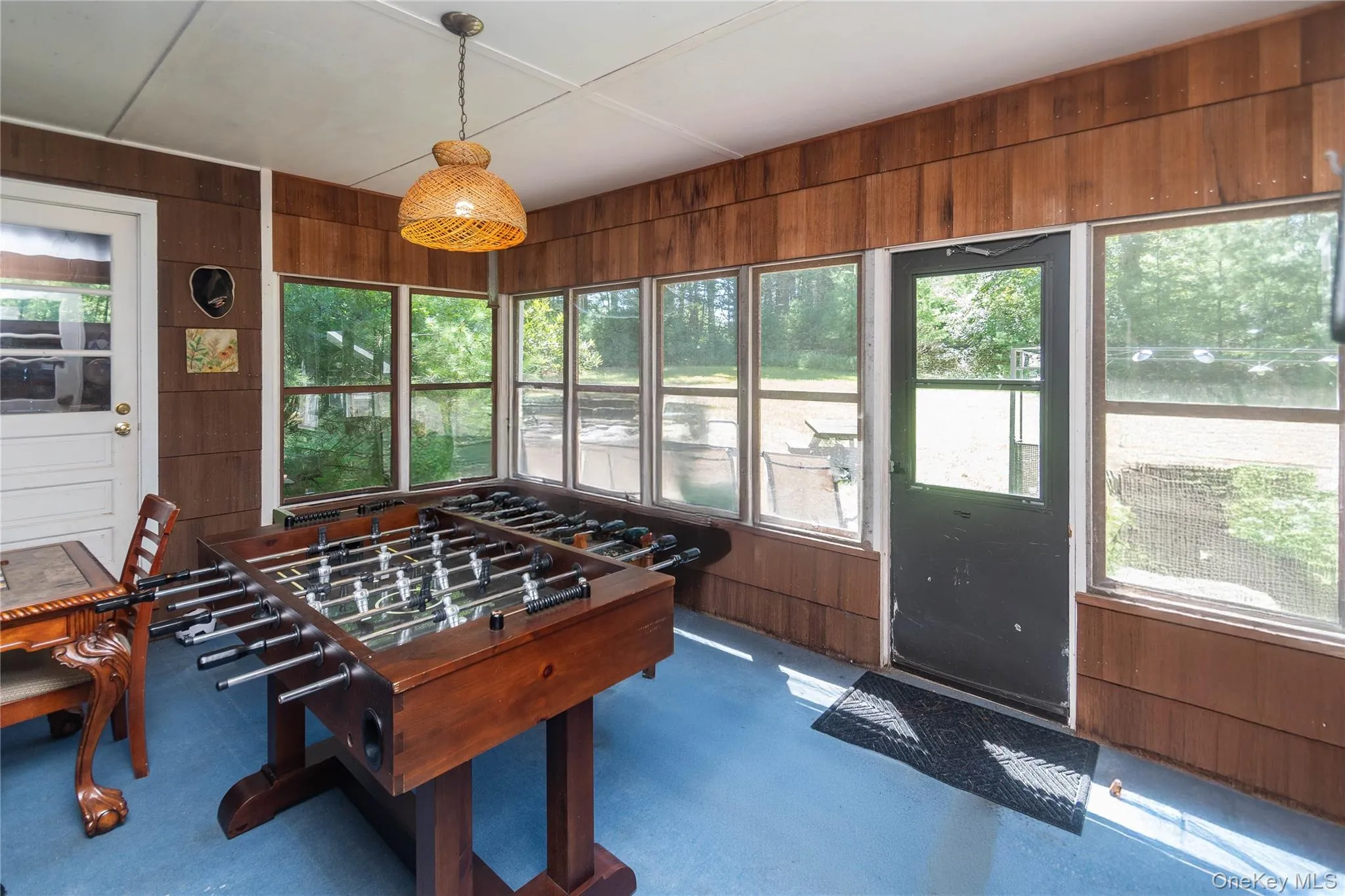 Recreation room with wood walls Recreation room with wood walls