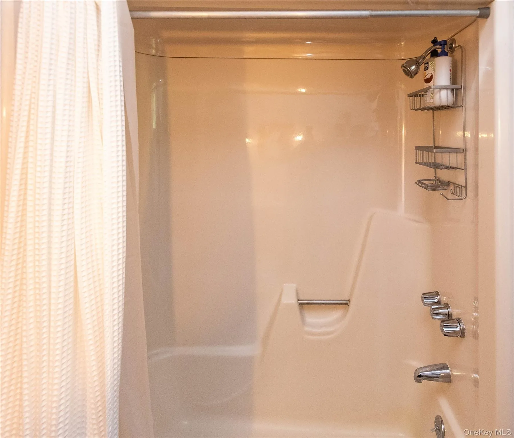 Full bathroom featuring shower / tub combo Full bathroom featuring shower / tub combo