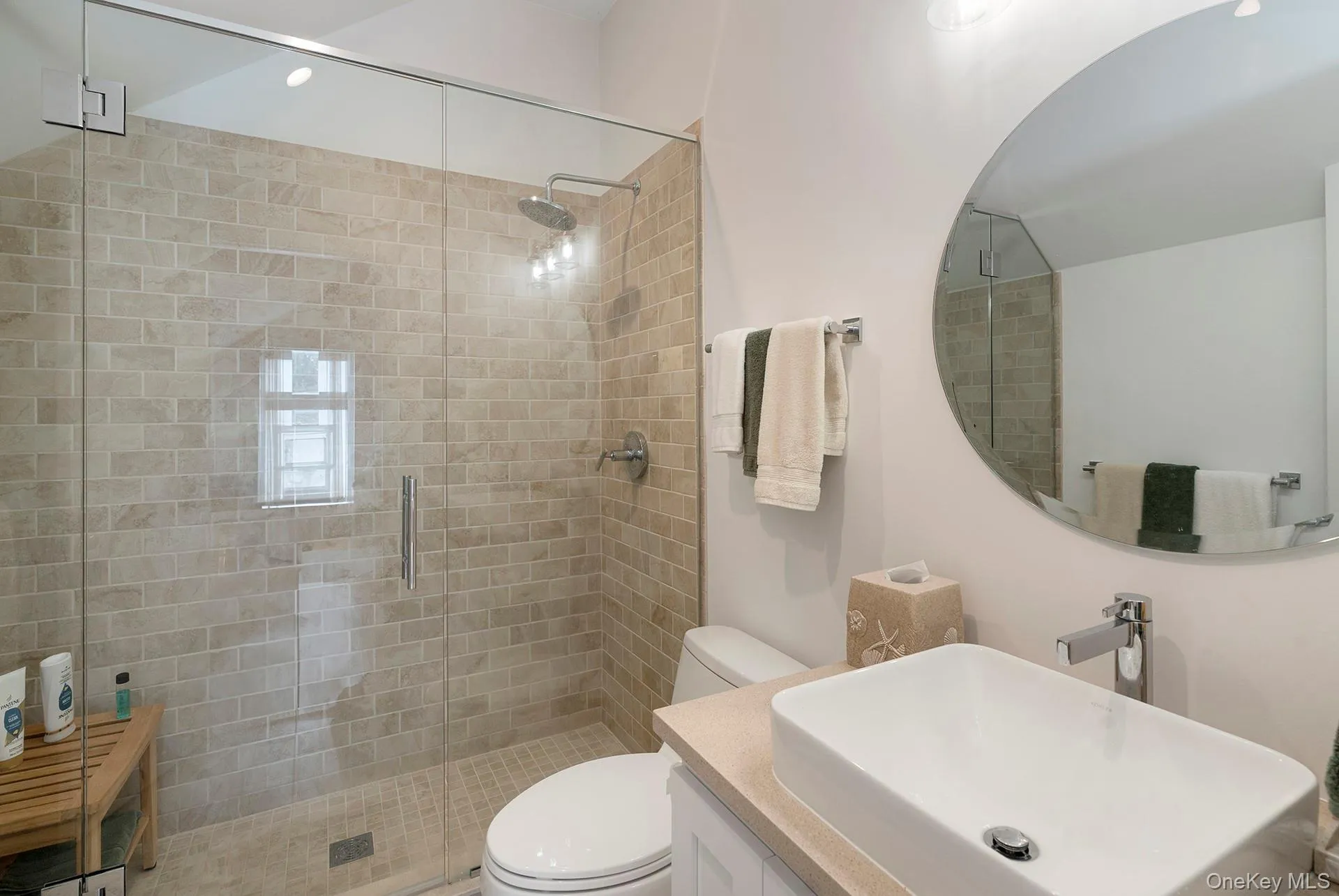 Full bathroom with vanity and a shower stall Full bathroom with vanity and a shower stall