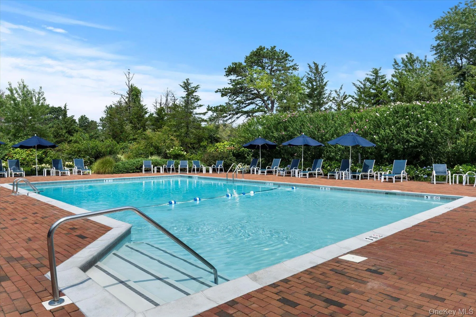 Community pool featuring a patio area Community pool featuring a patio area