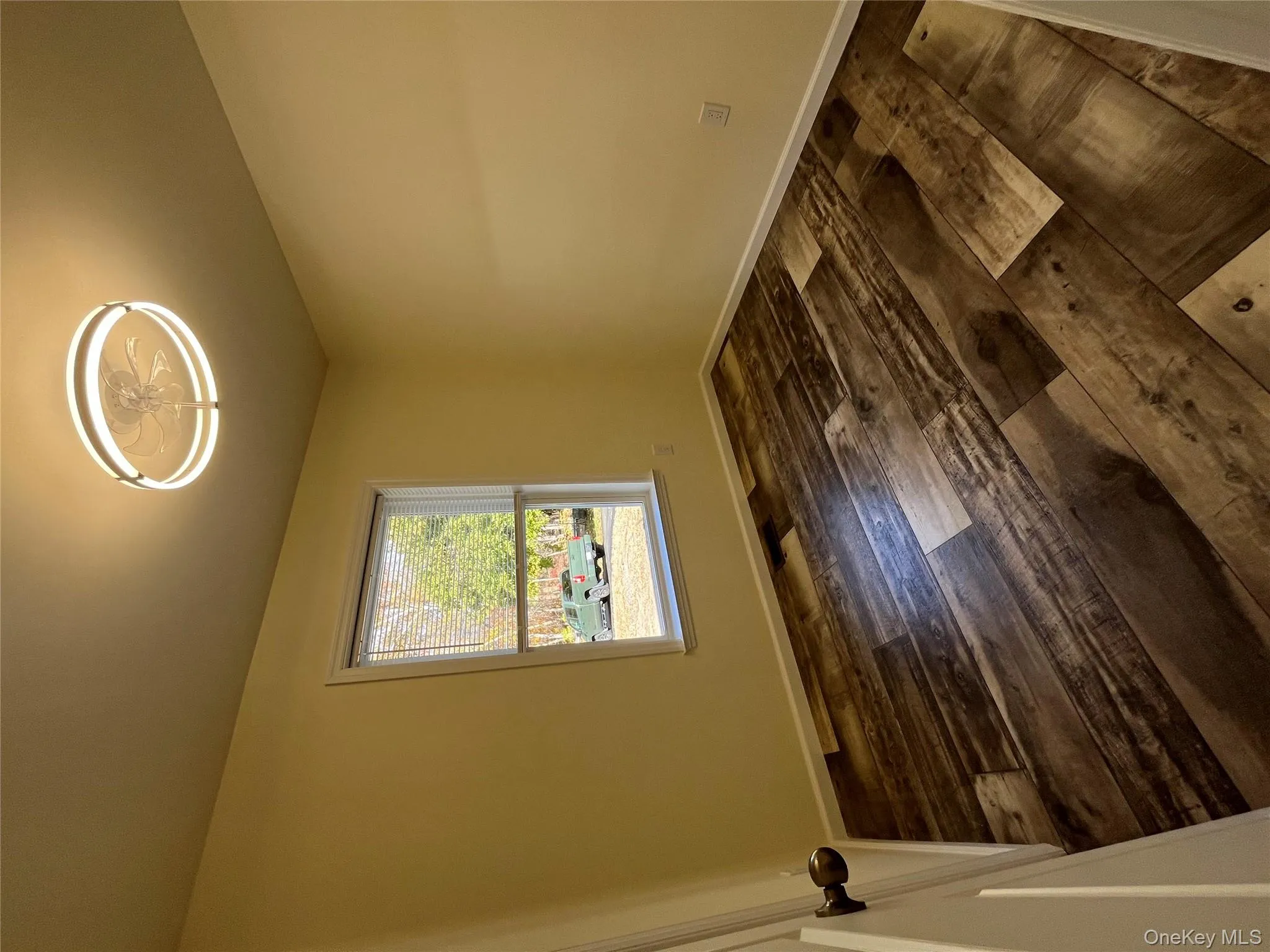 Unfurnished room featuring dark wood-type flooring and baseboards Unfurnished room featuring dark wood-type flooring and baseboards