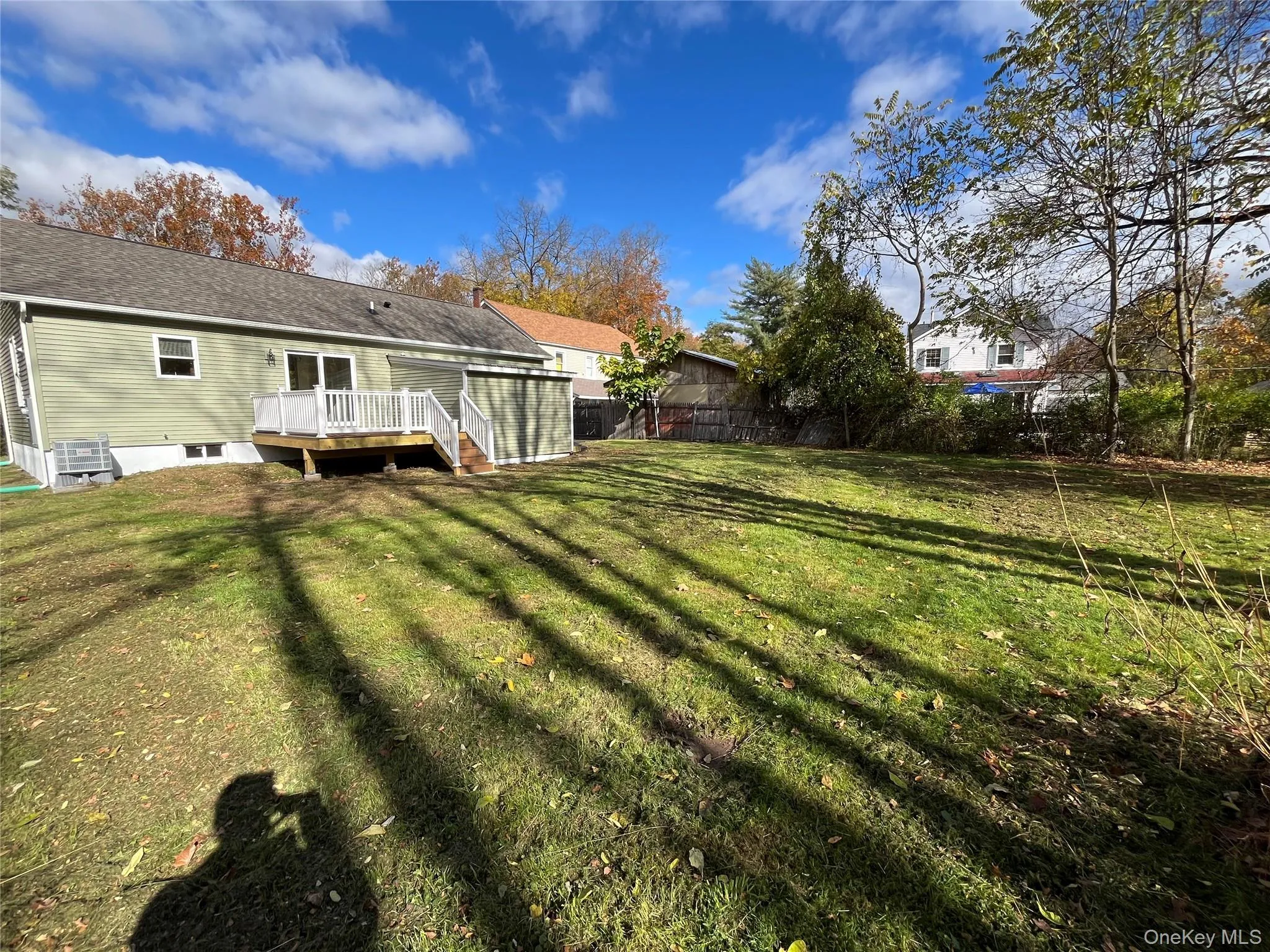 View of yard featuring a deck View of yard featuring a deck
