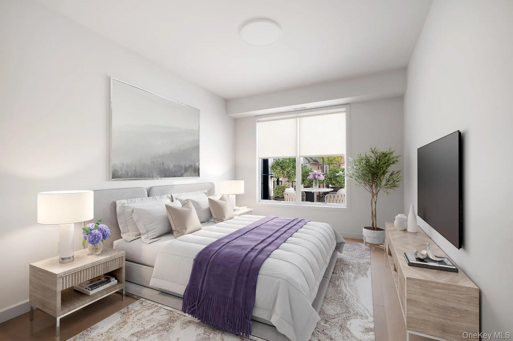 Bedroom with wood finished floors and baseboards Bedroom with wood finished floors and baseboards