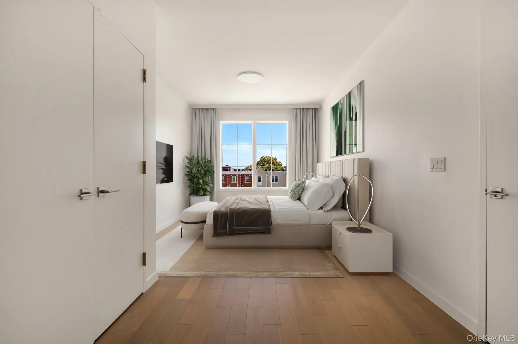 Bedroom with wood finished floors and baseboards Bedroom with wood finished floors and baseboards