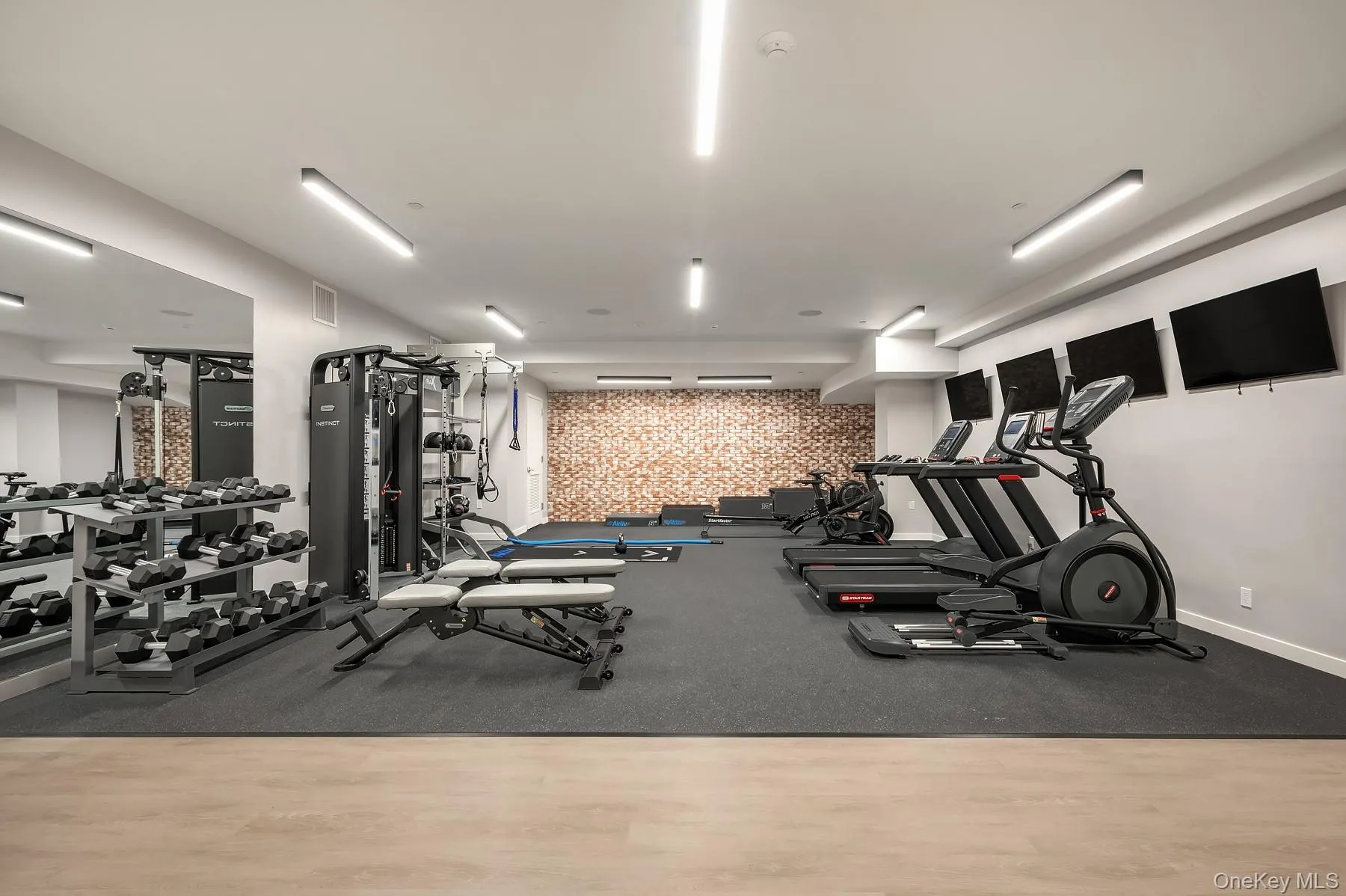 Gym with wallpapered walls Gym with wallpapered walls