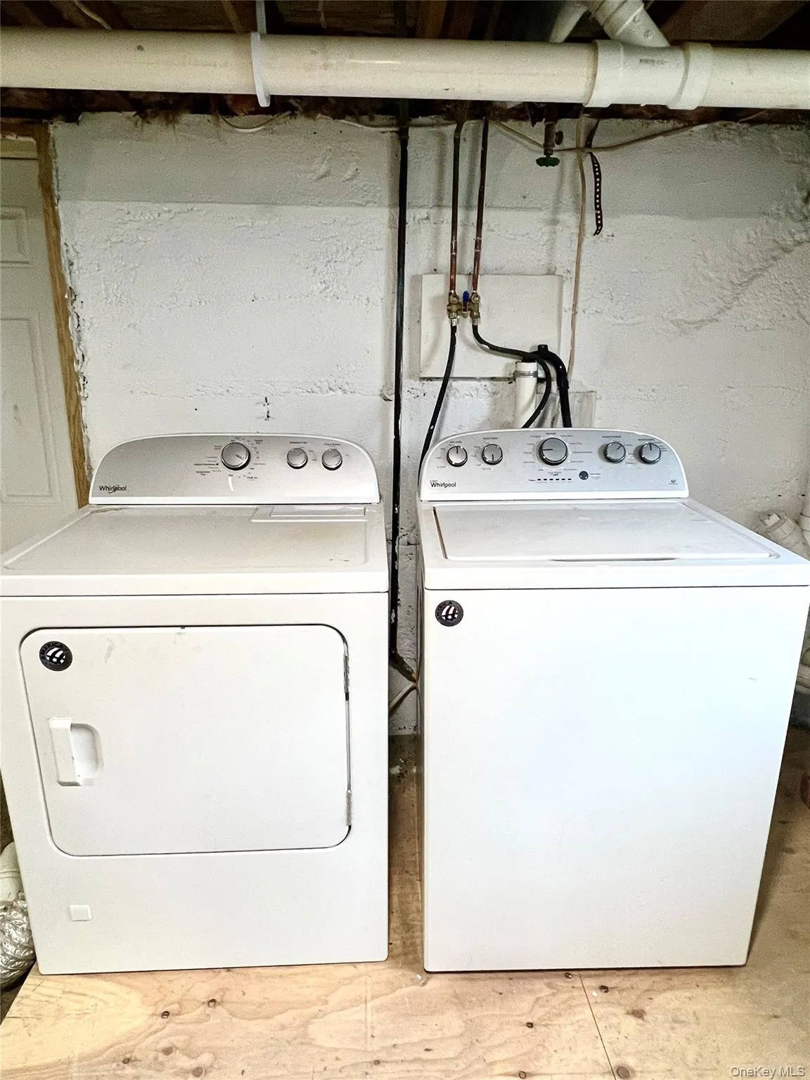 Washroom featuring washer and clothes dryer Washroom featuring washer and clothes dryer