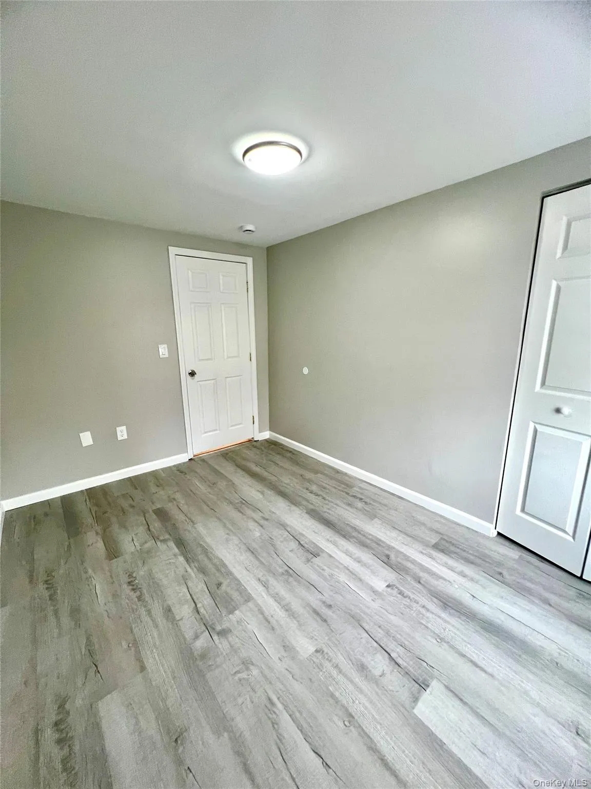 Unfurnished bedroom with light wood-type flooring Unfurnished bedroom with light wood-type flooring