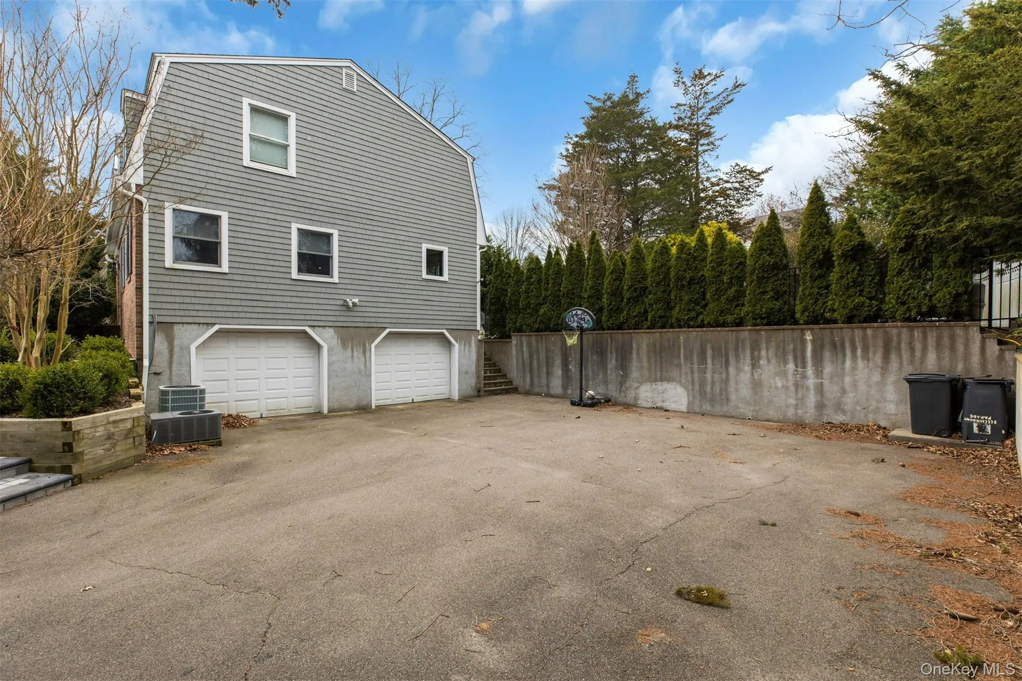 View of home's exterior featuring driveway and an attached garage View of home's exterior featuring driveway and an attached garage