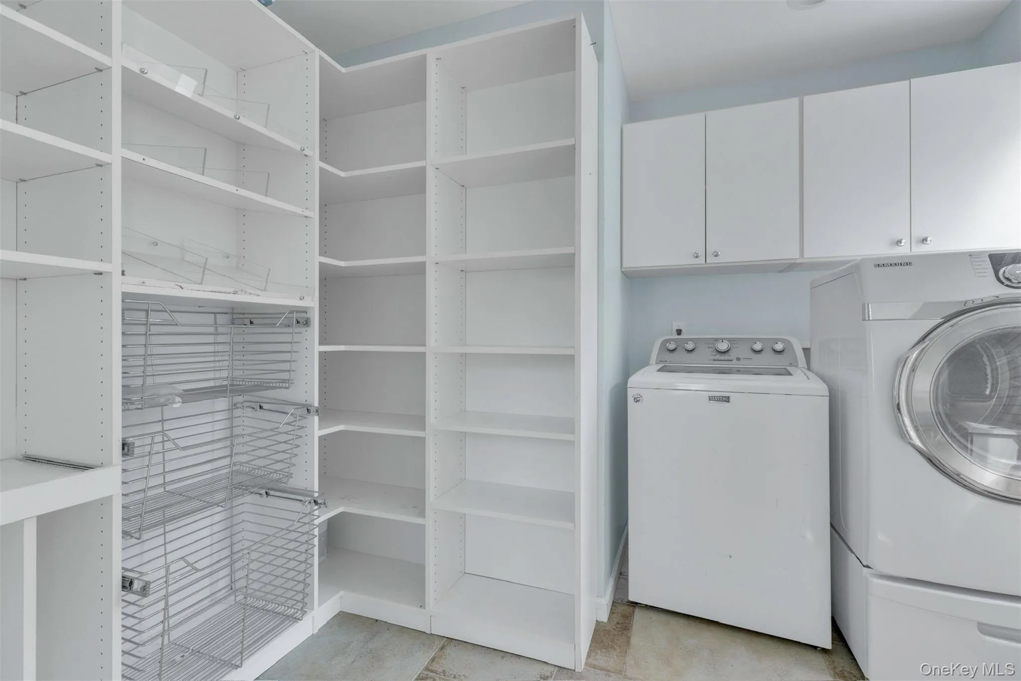 Laundry room with cabinet space and washer and dryer Laundry room with cabinet space and washer and dryer