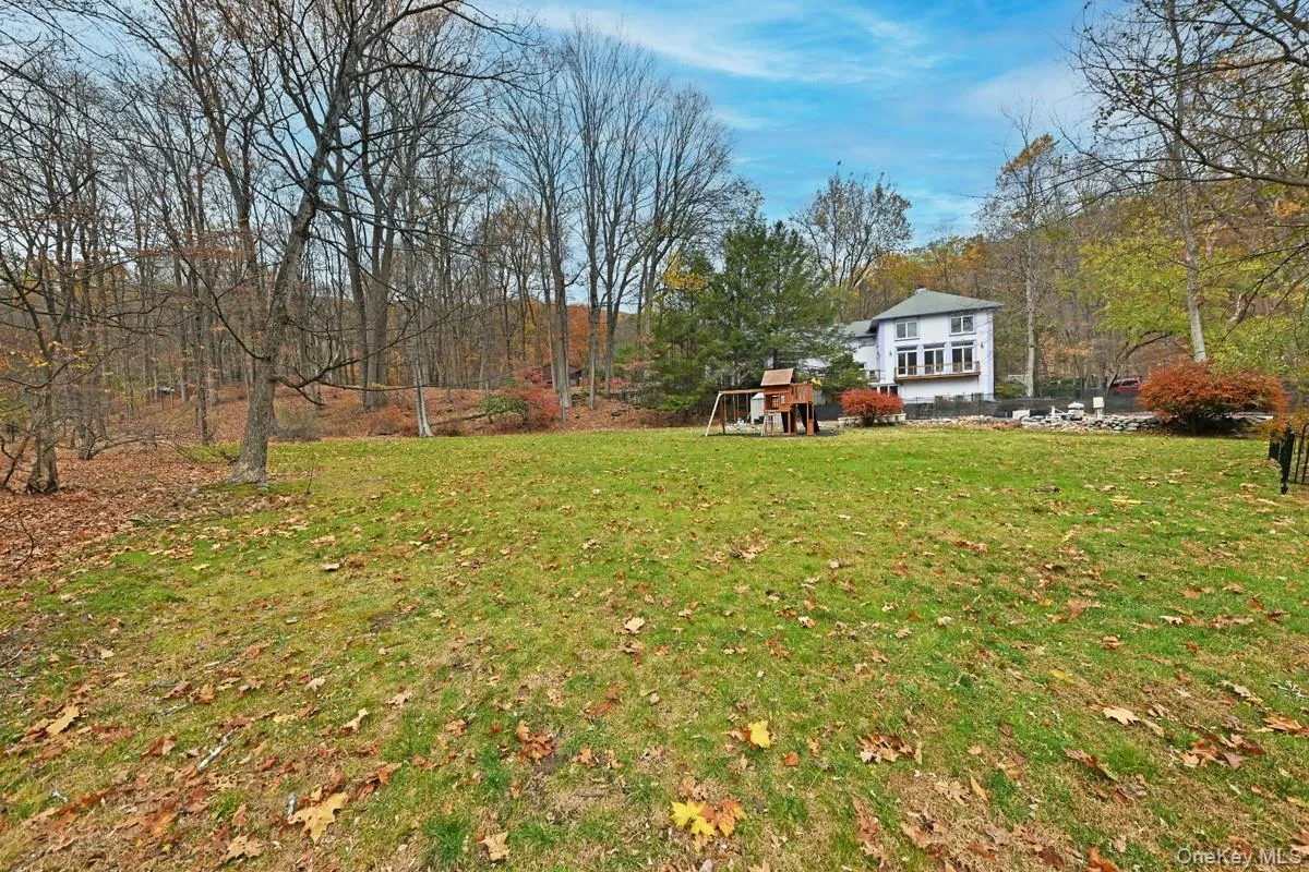 View of grassy yard with a playground View of grassy yard with a playground