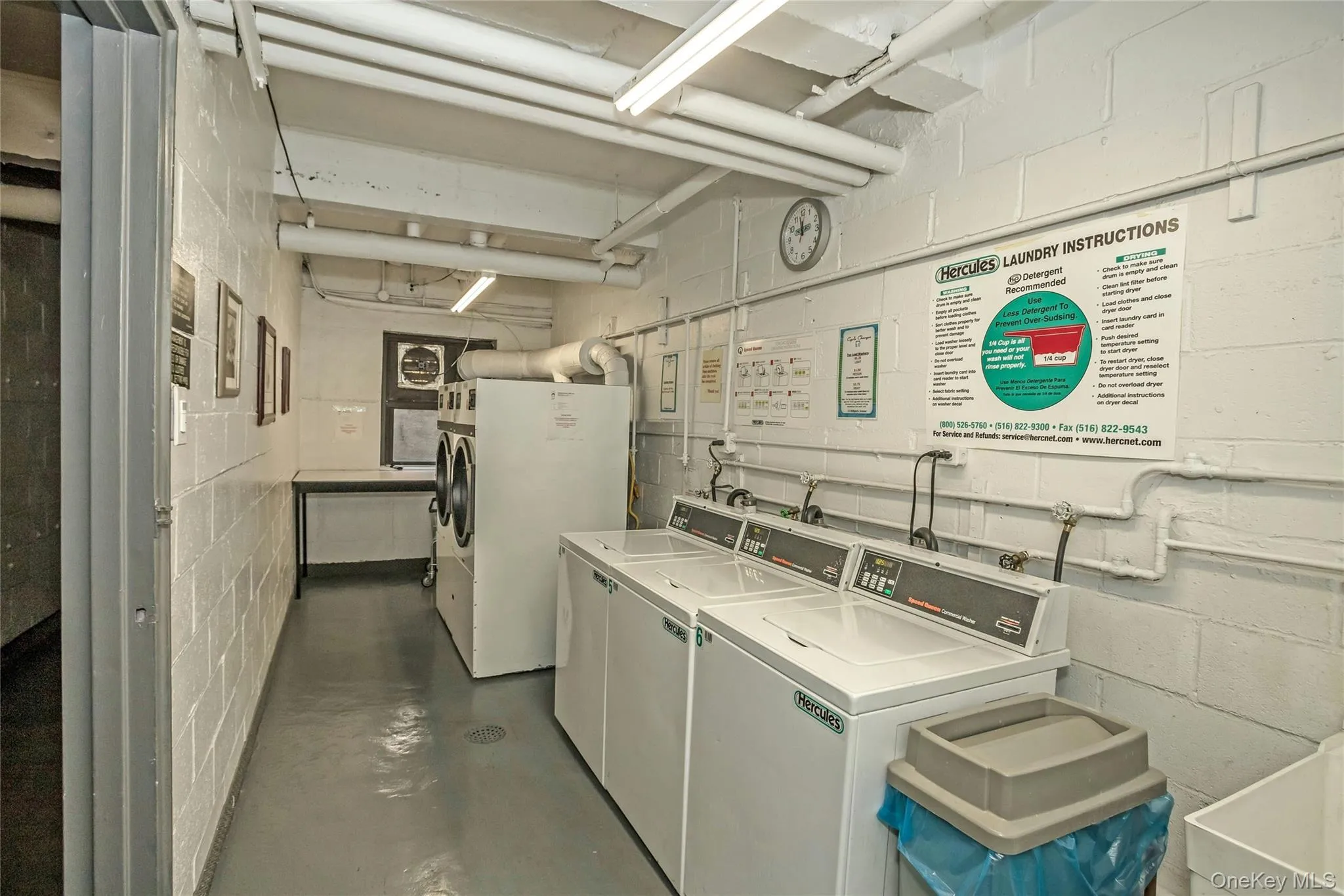 Shared laundry room with separate washer and dryer Shared laundry room with separate washer and dryer