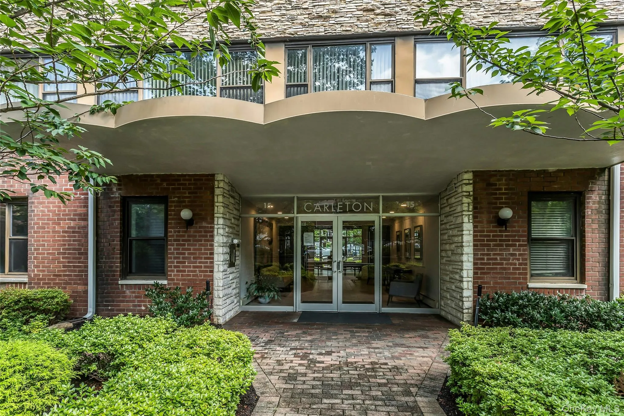 View of exterior entry with french doors and brick siding View of exterior entry with french doors and brick siding