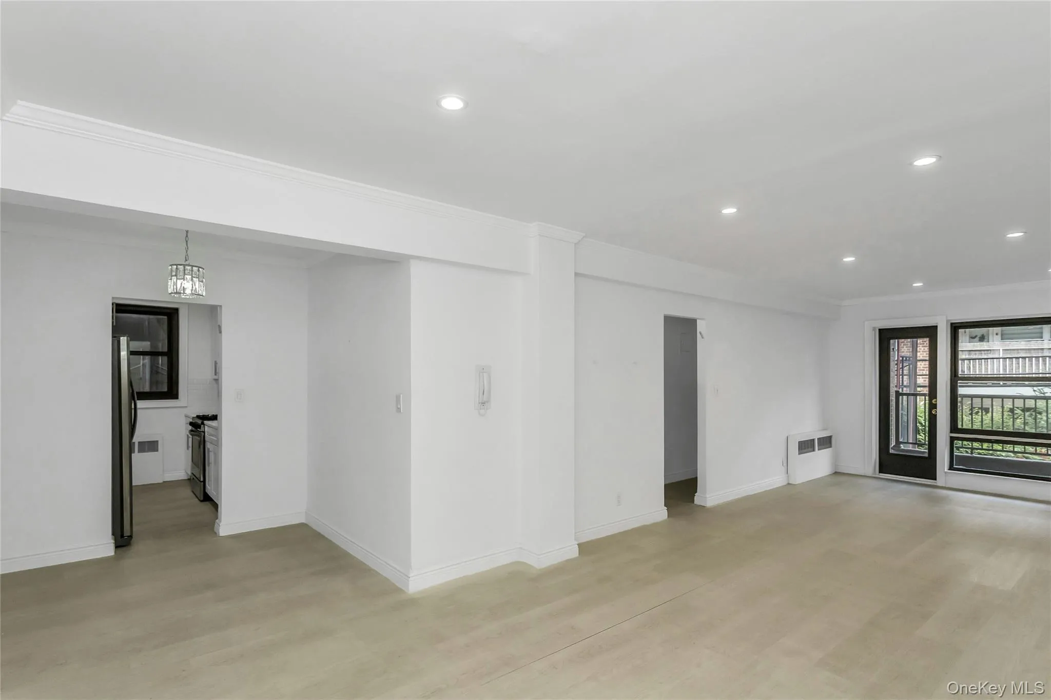 Unfurnished room with recessed lighting, crown molding, and light wood-style flooring Unfurnished room with recessed lighting, crown molding, and light wood-style flooring