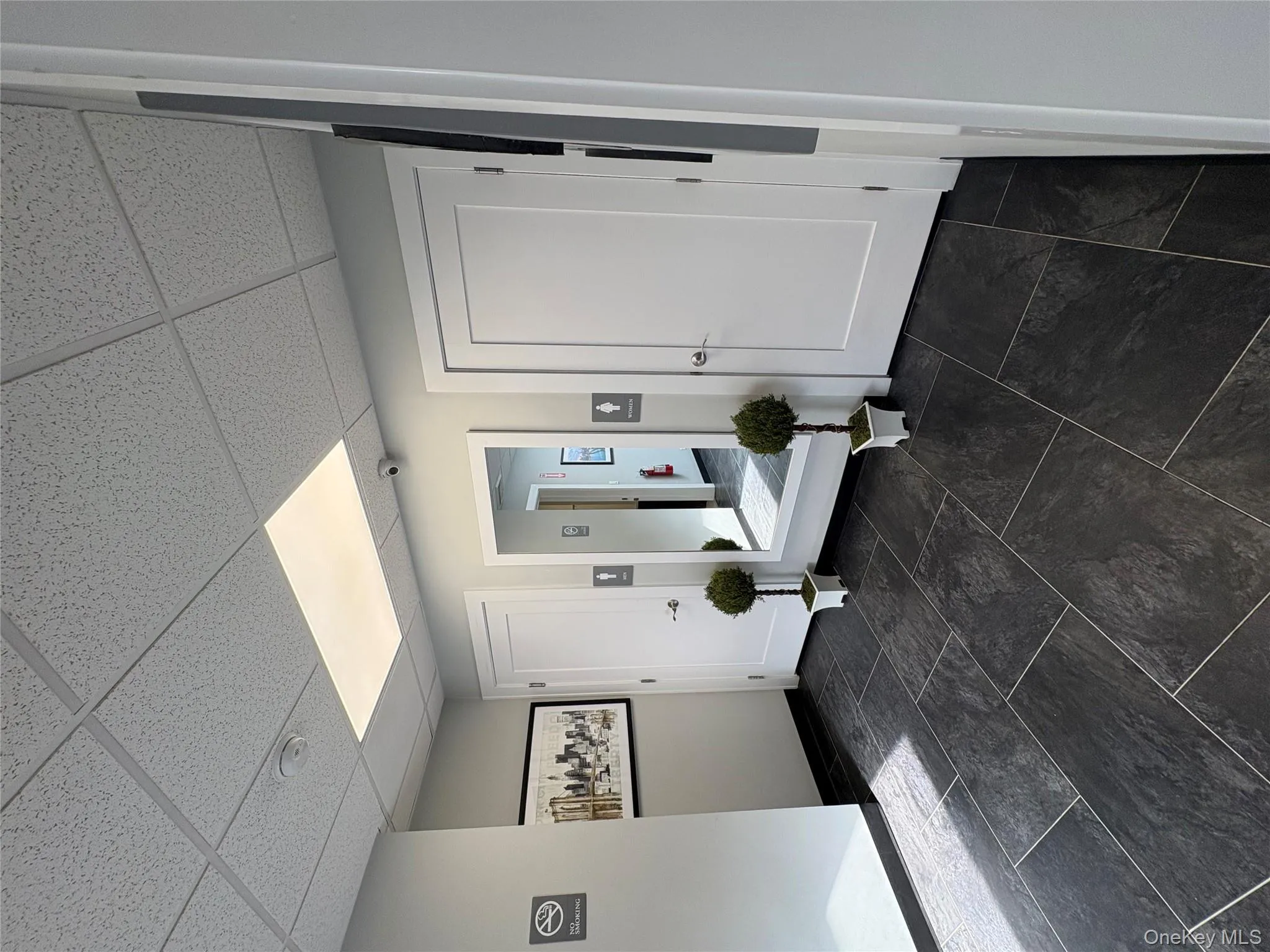 Foyer entrance featuring a paneled ceiling Foyer entrance featuring a paneled ceiling