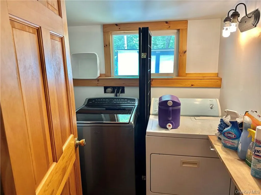 Laundry room featuring independent washer and dryer Laundry room featuring independent washer and dryer