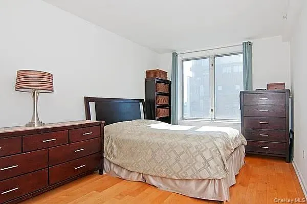 Bedroom with light wood-type flooring Bedroom with light wood-type flooring