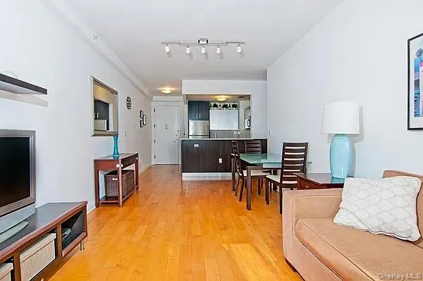 Living area featuring light wood finished floors Living area featuring light wood finished floors