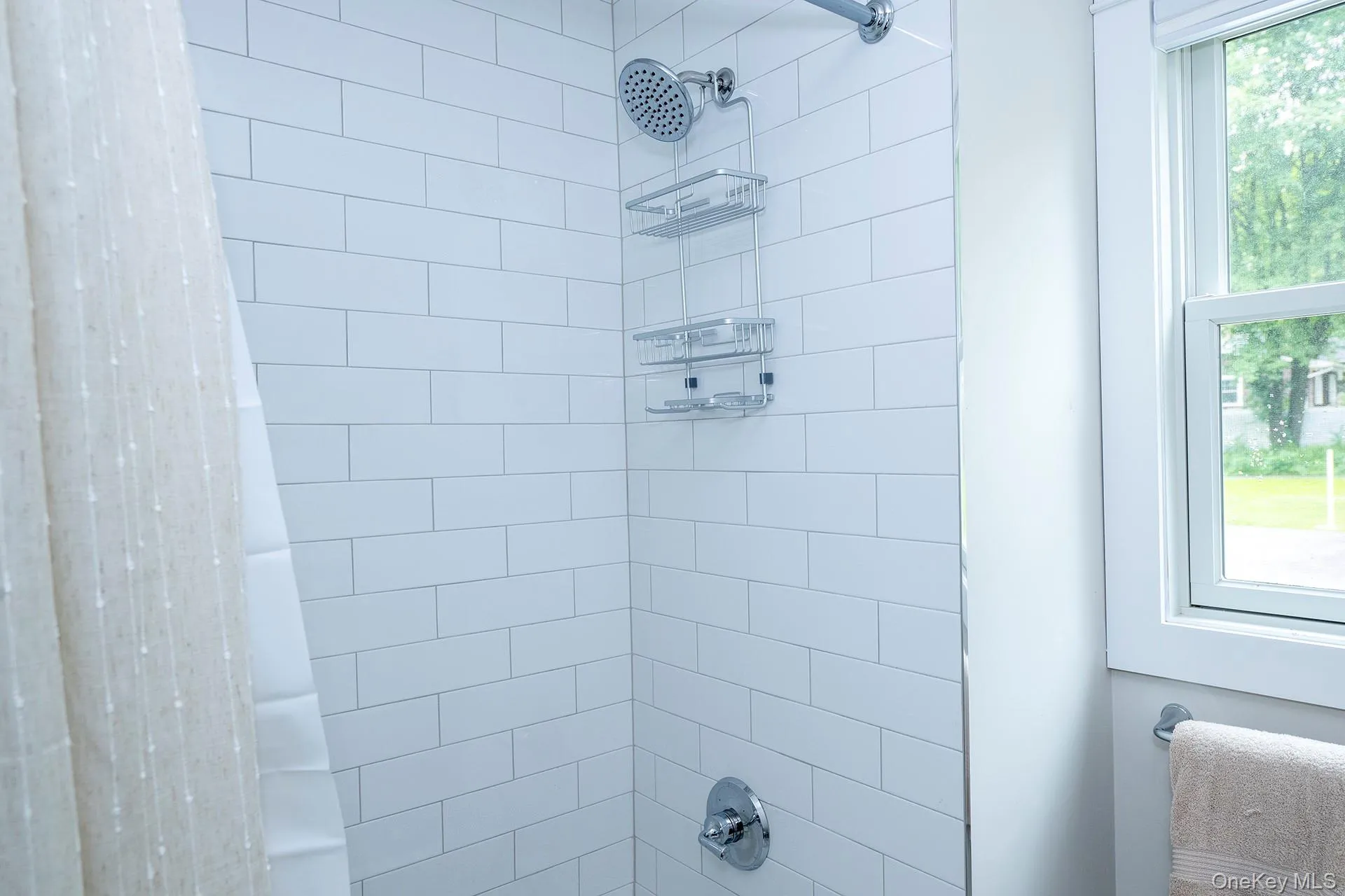 Bathroom with shower / bath combo with shower curtain Bathroom with shower / bath combo with shower curtain