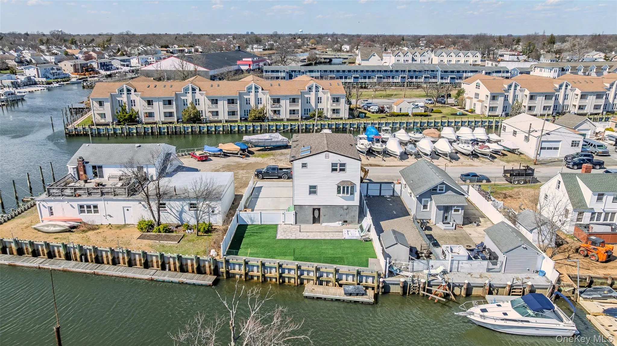 Aerial perspective of suburban area with a large body of water Aerial perspective of suburban area with a large body of water