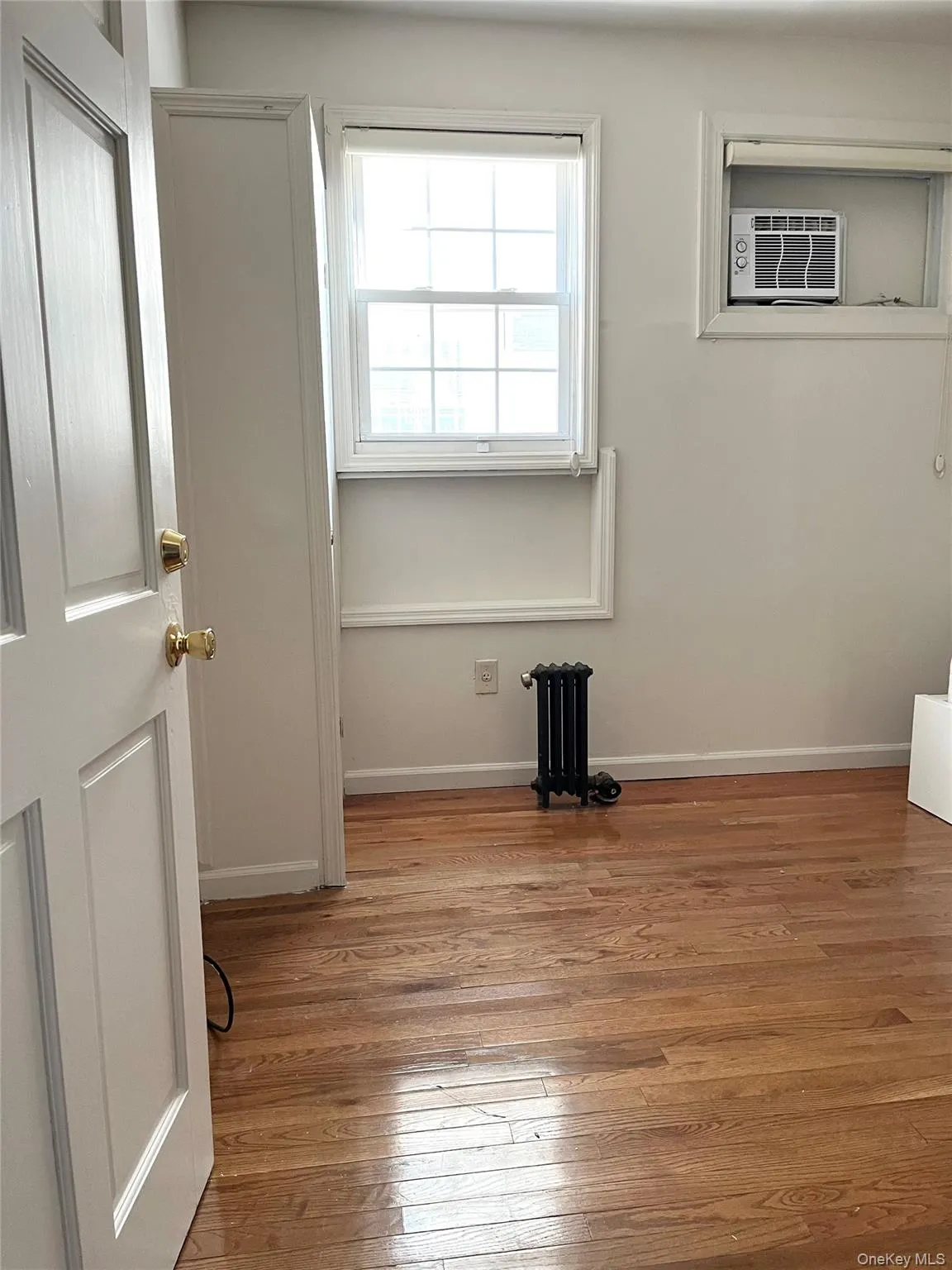 Empty room featuring light wood-style floors and baseboards Empty room featuring light wood-style floors and baseboards