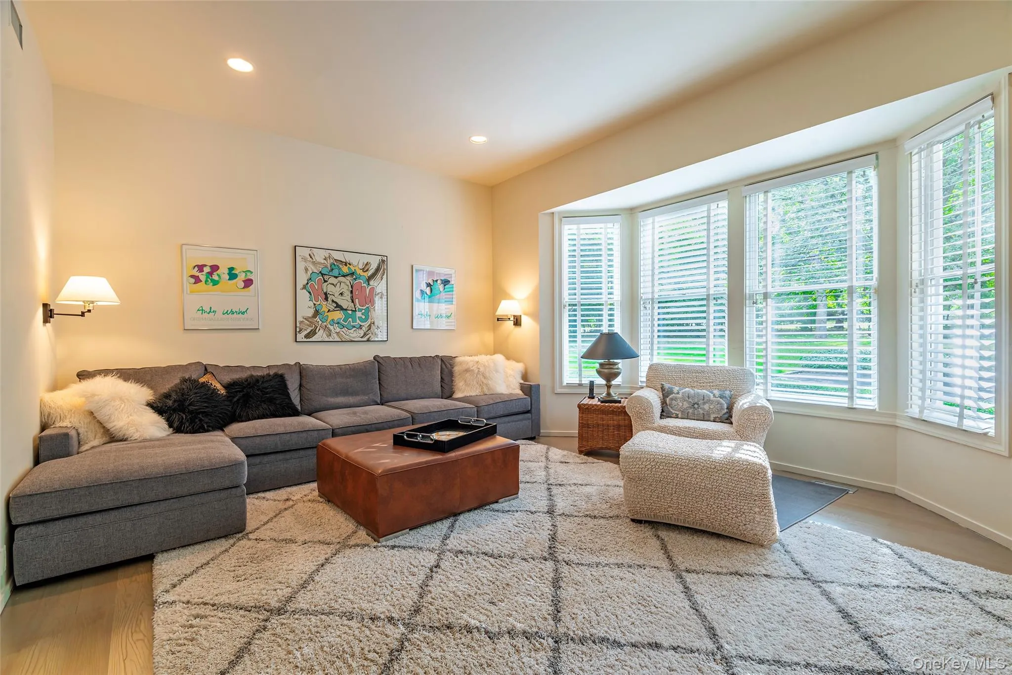 Living room with wood finished floors and recessed lighting Living room with wood finished floors and recessed lighting