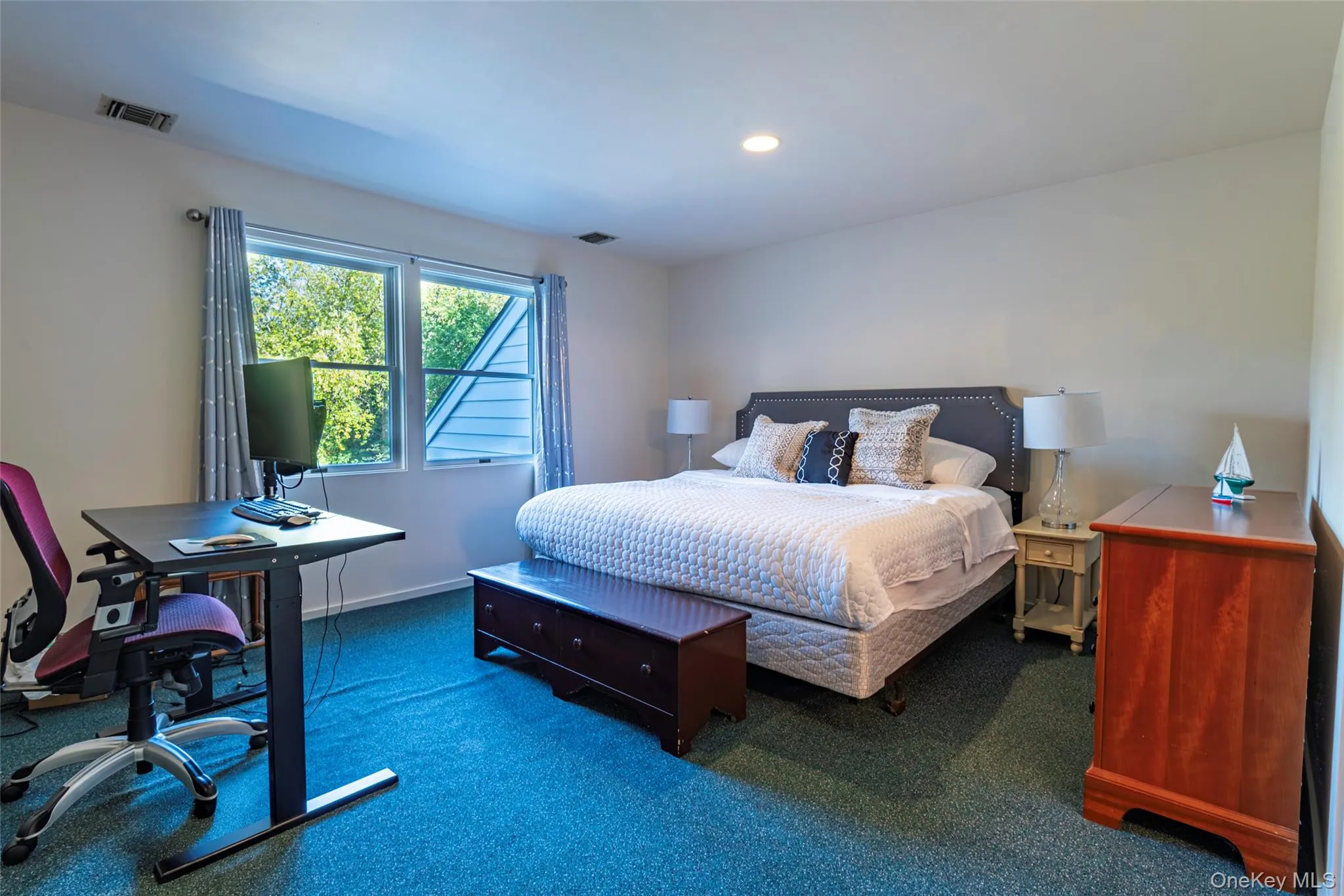 Bedroom featuring carpet, a desk, and recessed lighting Bedroom featuring carpet, a desk, and recessed lighting