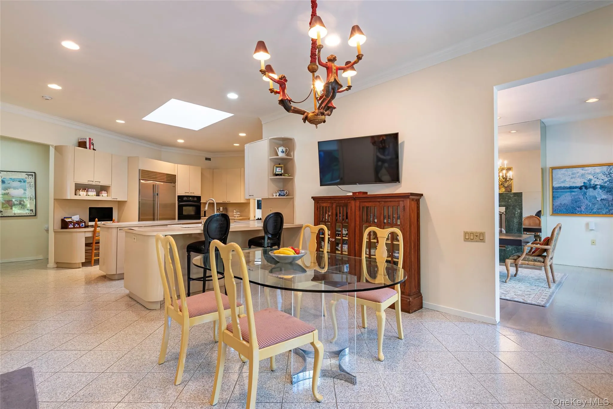 Dining space featuring ornamental molding, a chandelier, recessed lighting, and a skylight Dining space featuring ornamental molding, a chandelier, recessed lighting, and a skylight