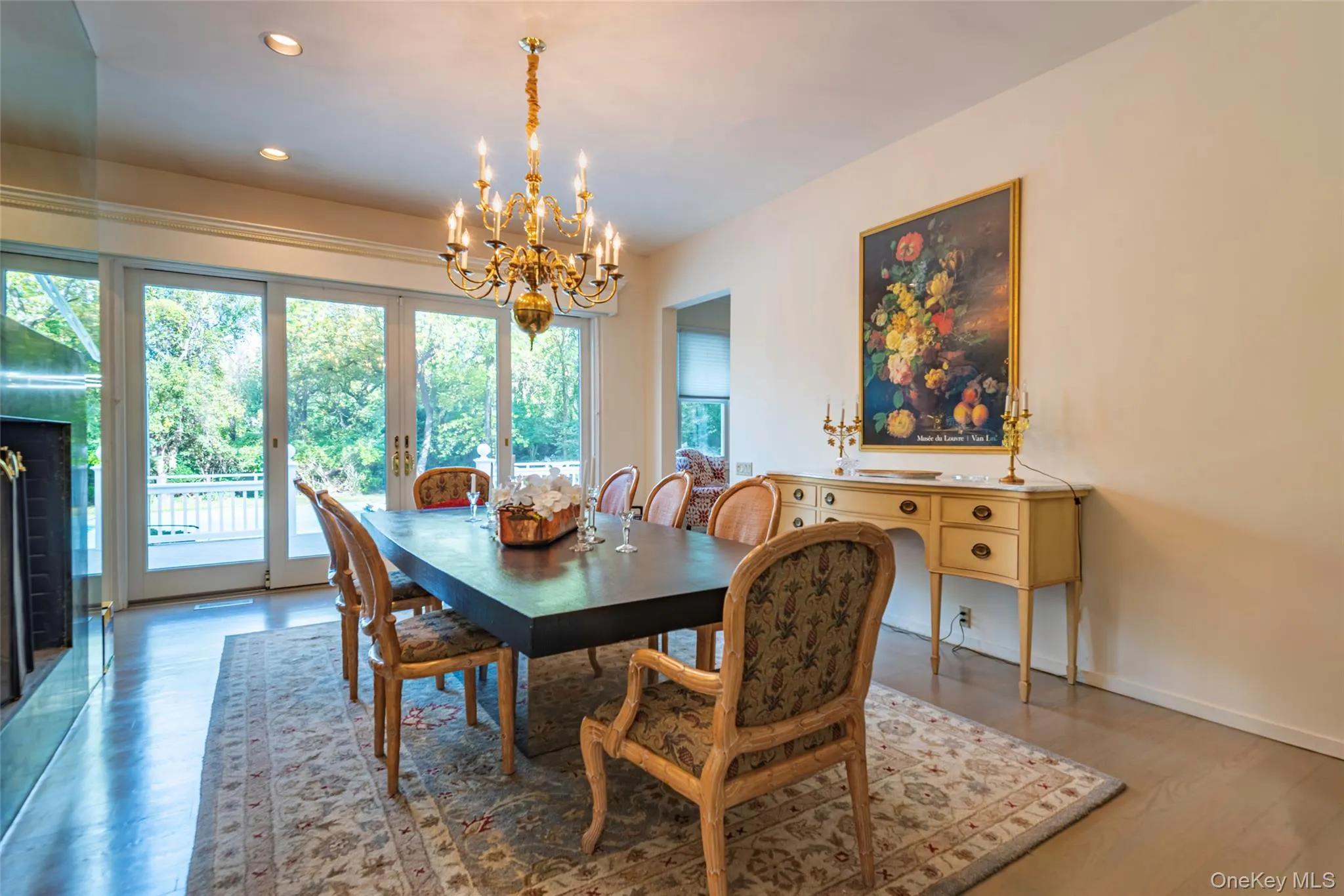 Dining space featuring a chandelier, recessed lighting, and wood finished floors Dining space featuring a chandelier, recessed lighting, and wood finished floors