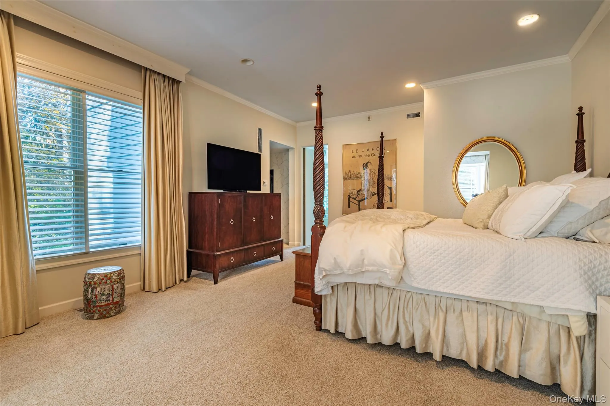 Bedroom featuring ornamental molding, light carpet, and recessed lighting Bedroom featuring ornamental molding, light carpet, and recessed lighting