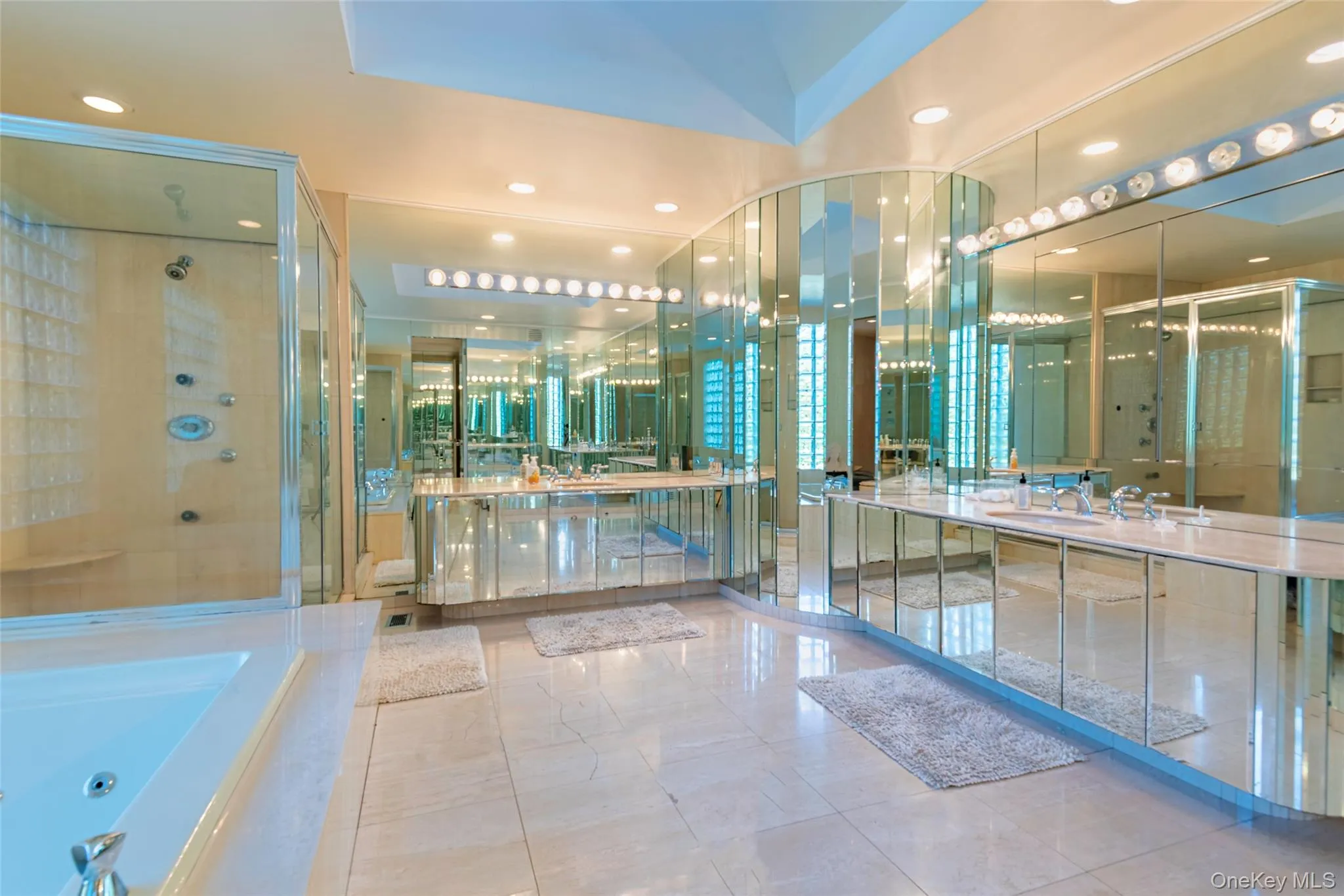 Full bathroom featuring a stall shower, recessed lighting, a whirlpool tub, vanity, and tile patterned floors Full bathroom featuring a stall shower, recessed lighting, a whirlpool tub, vanity, and tile patterned floors