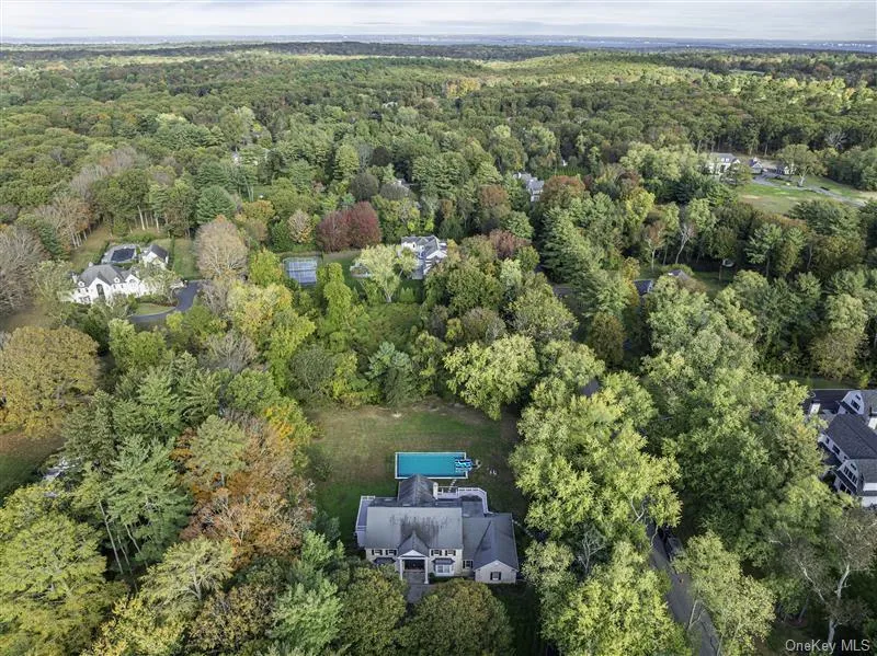 Aerial overview of property's location with a heavily wooded area Aerial overview of property's location with a heavily wooded area