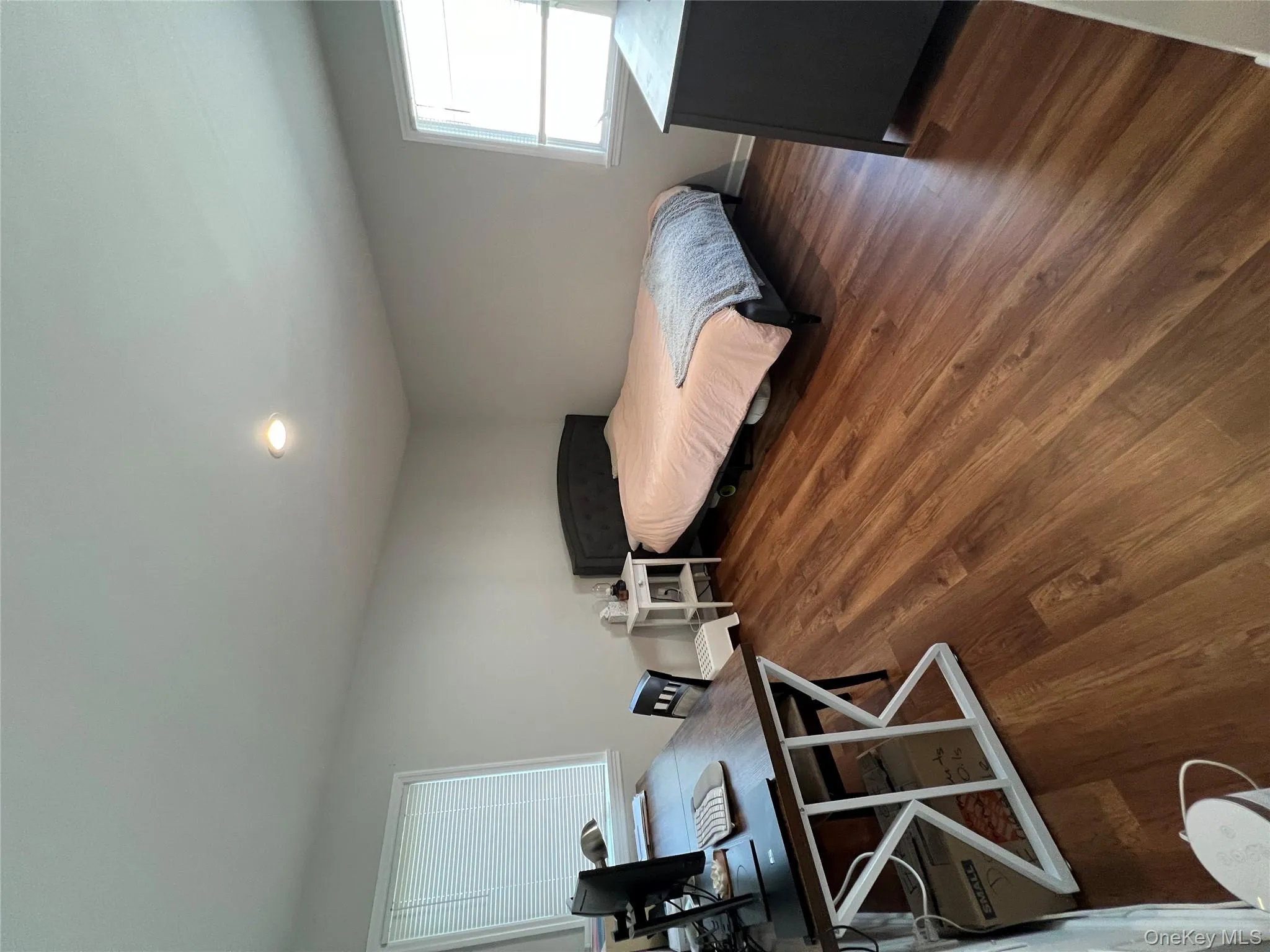 Bedroom featuring dark wood finished floors and recessed lighting Bedroom featuring dark wood finished floors and recessed lighting