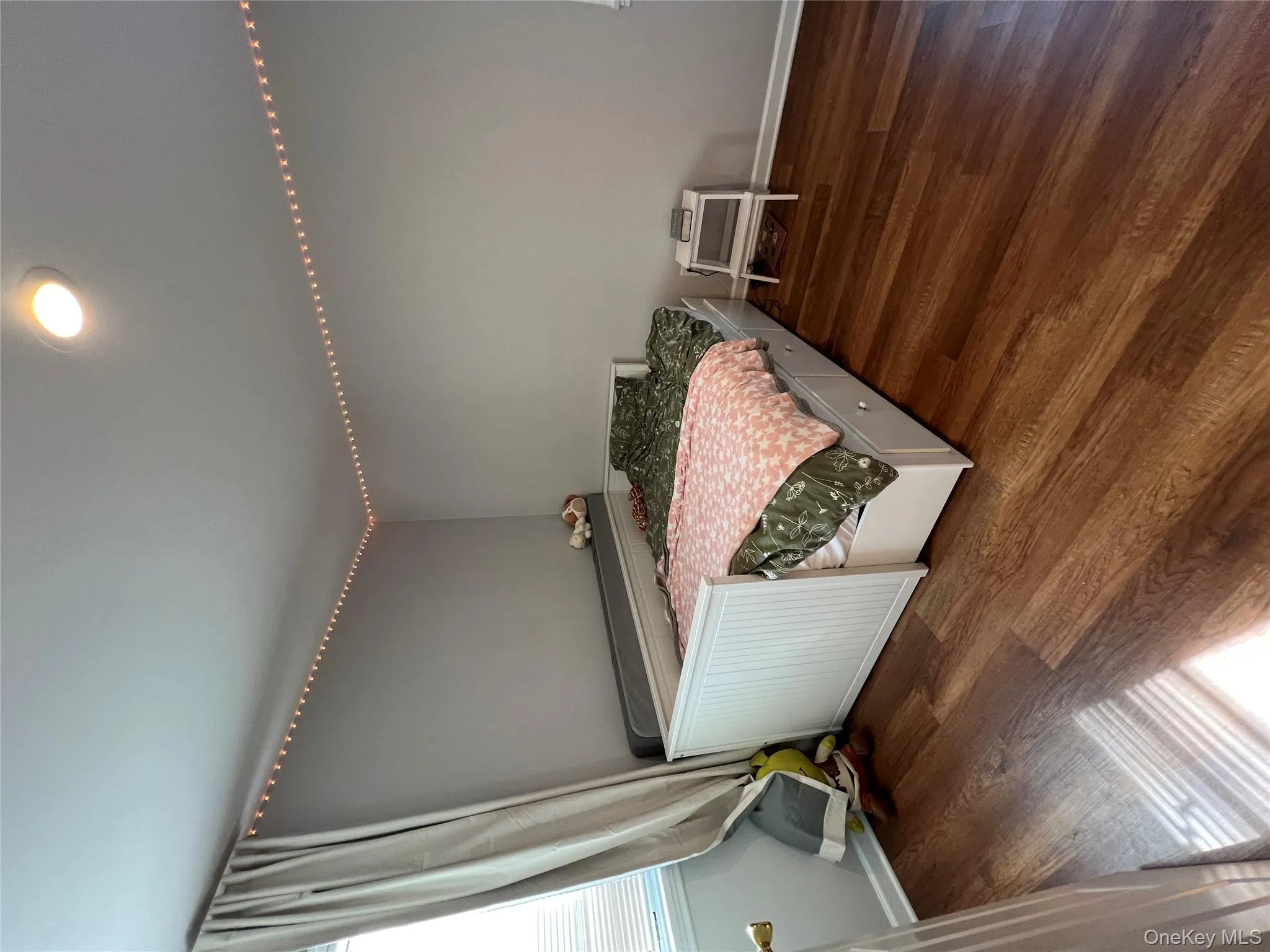 Bedroom featuring dark wood-style floors and recessed lighting Bedroom featuring dark wood-style floors and recessed lighting