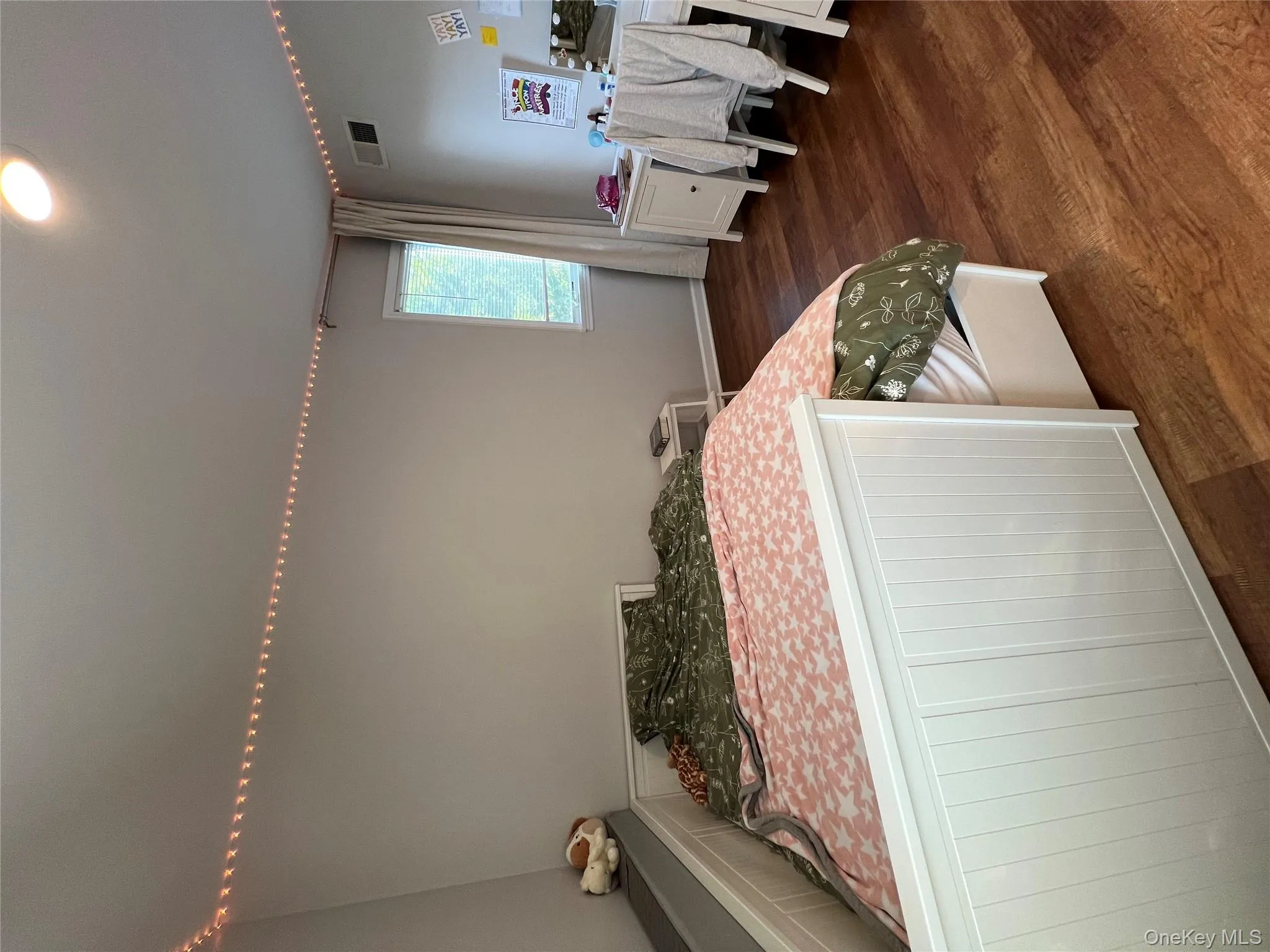 Bedroom featuring dark wood-style floors and recessed lighting Bedroom featuring dark wood-style floors and recessed lighting
