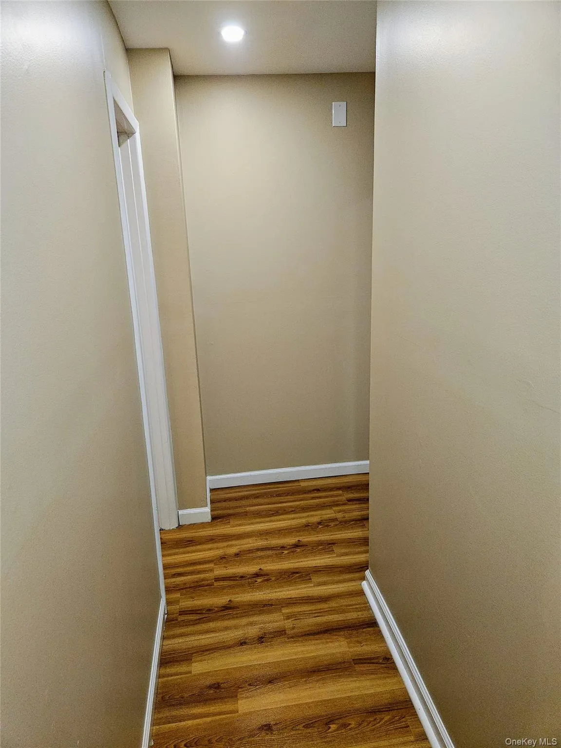 Hallway from kitchen to bathroom and main bath. Hallway from kitchen to bathroom and main bath.