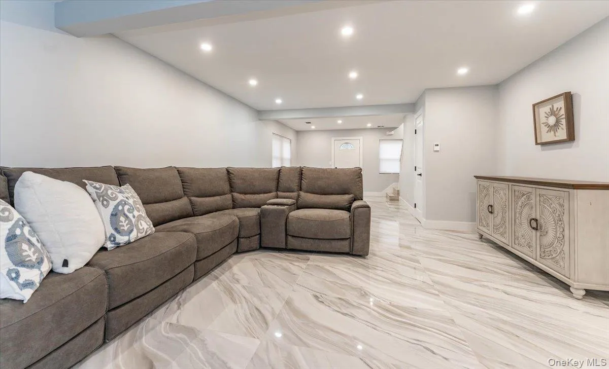 Living area with recessed lighting and baseboards Living area with recessed lighting and baseboards