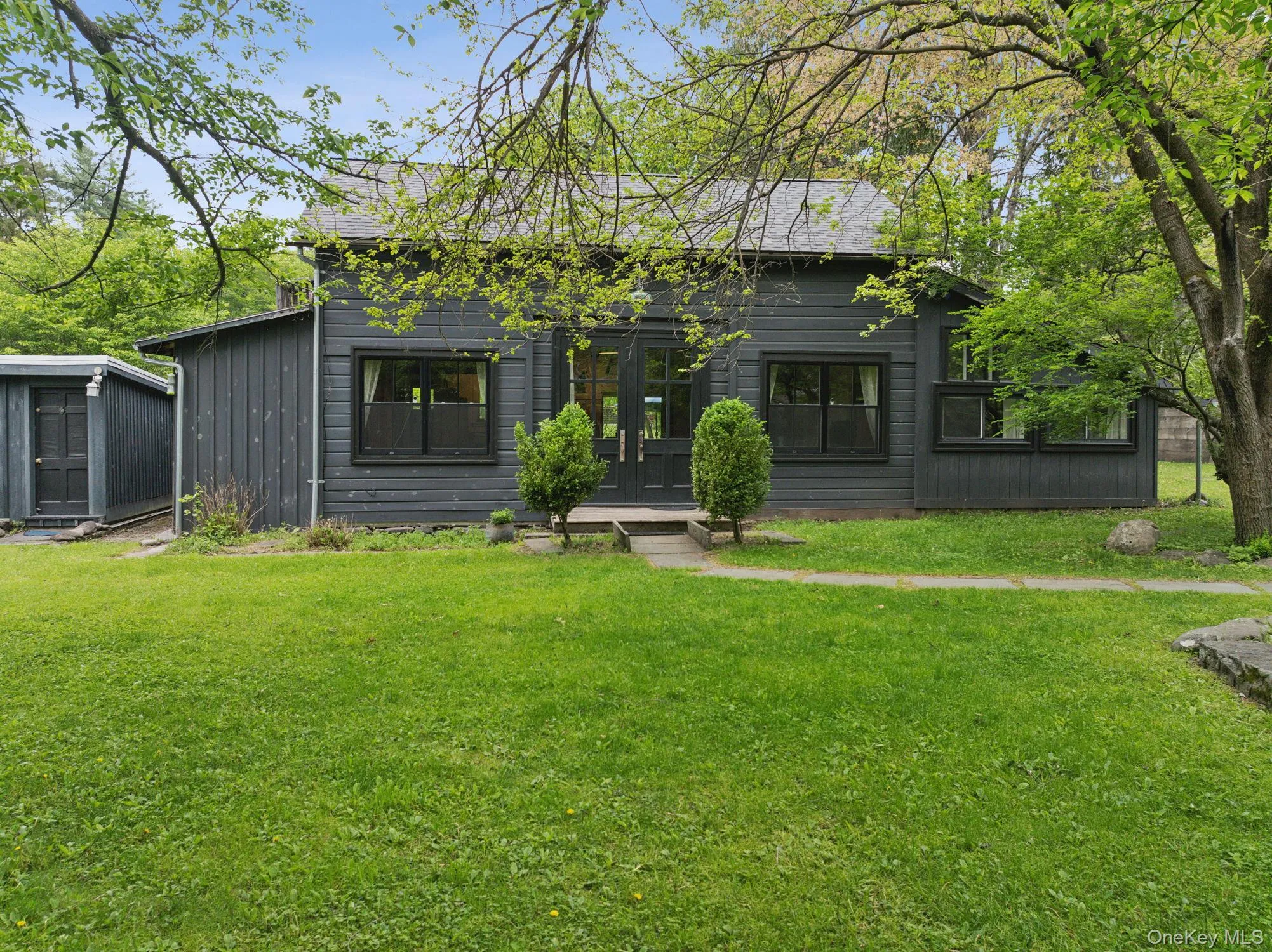 Back of property with a lawn Back of property with a lawn