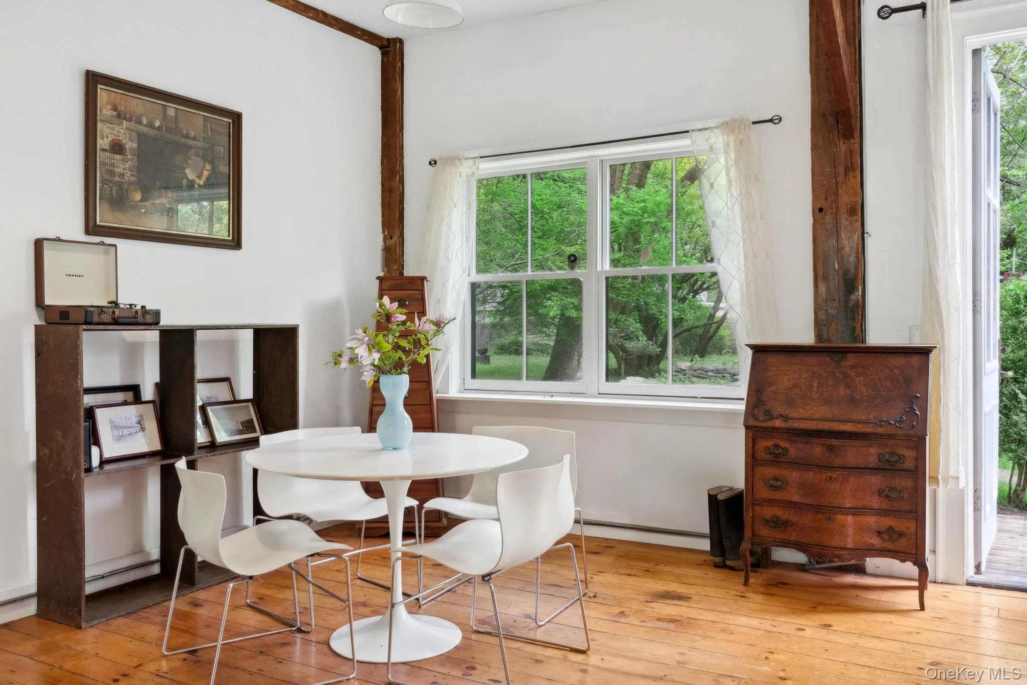 Dining room with hardwood / wood-style flooring and baseboard heating Dining room with hardwood / wood-style flooring and baseboard heating