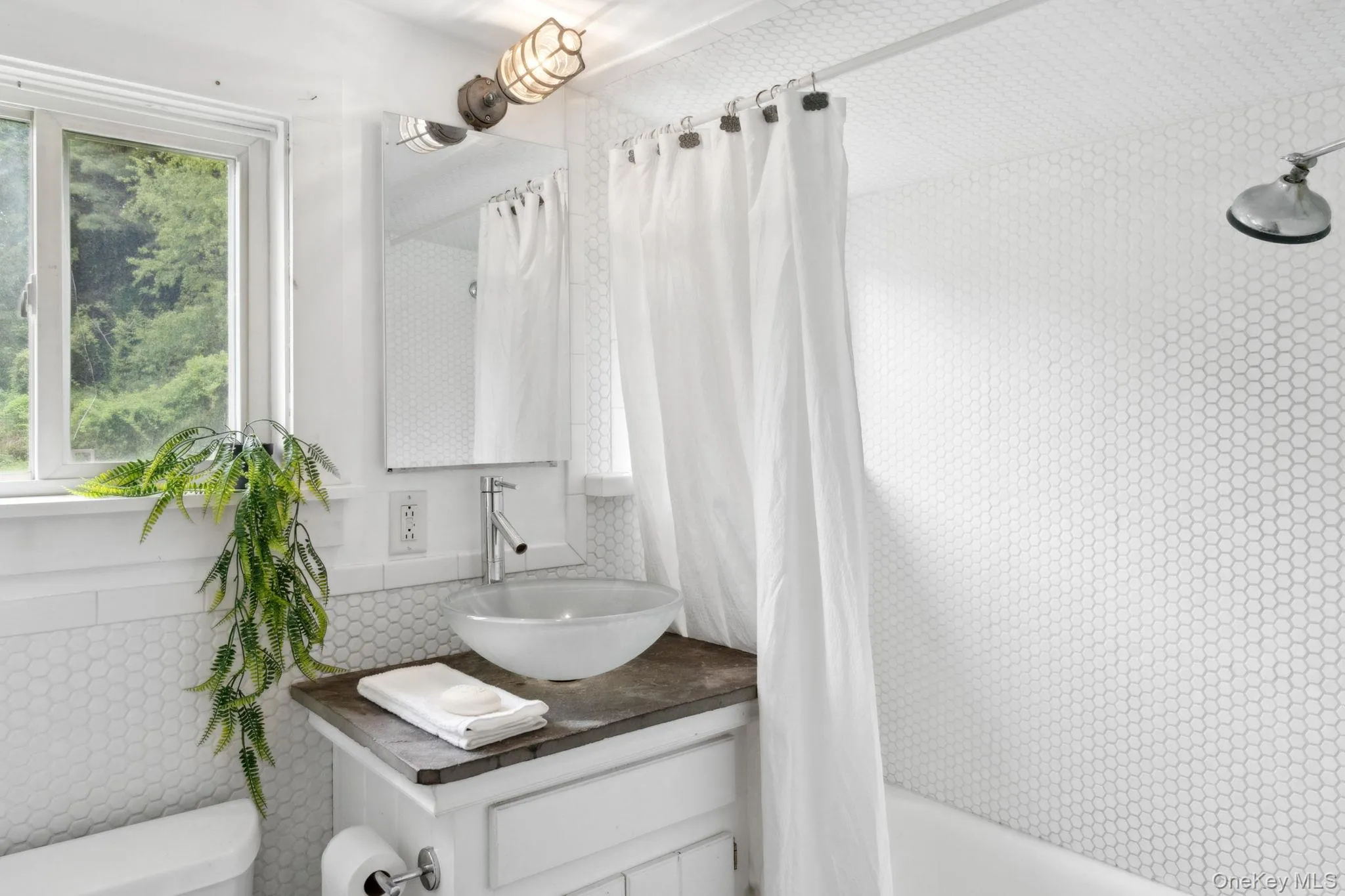 Full bath with vanity and shower / tub combo with curtain Full bath with vanity and shower / tub combo with curtain