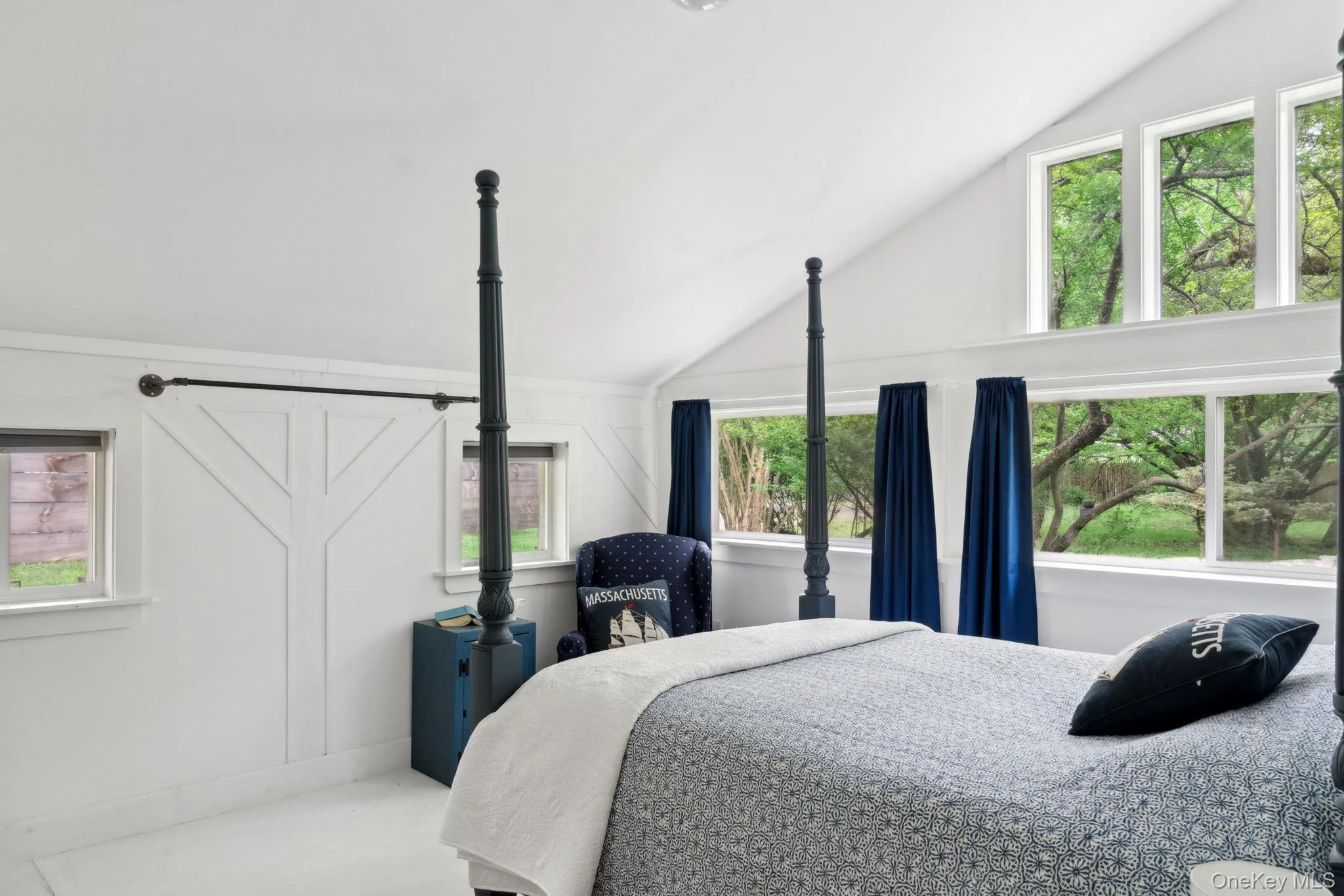 Bedroom featuring vaulted ceiling Bedroom featuring vaulted ceiling