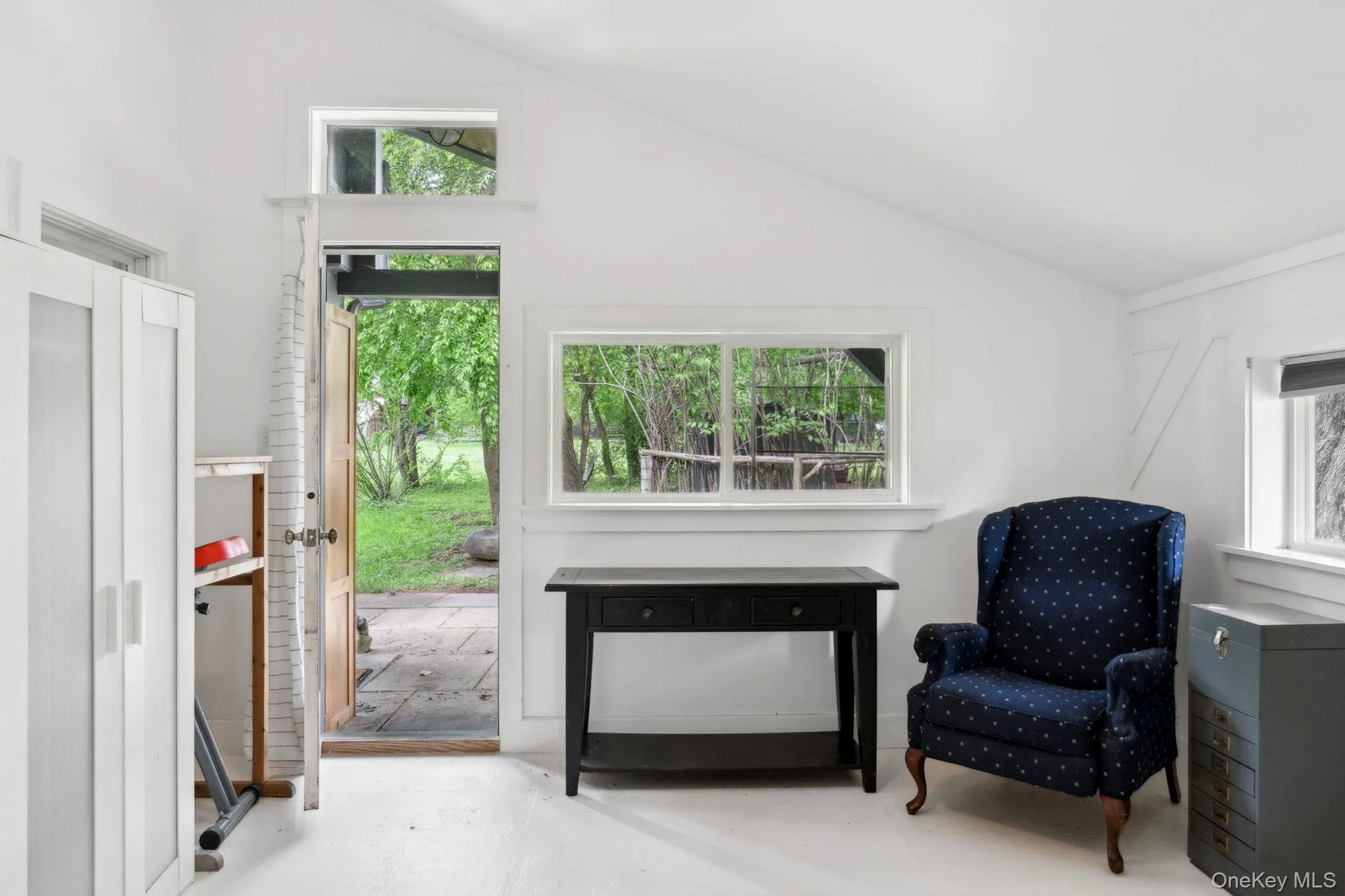 Living area featuring lofted ceiling Living area featuring lofted ceiling
