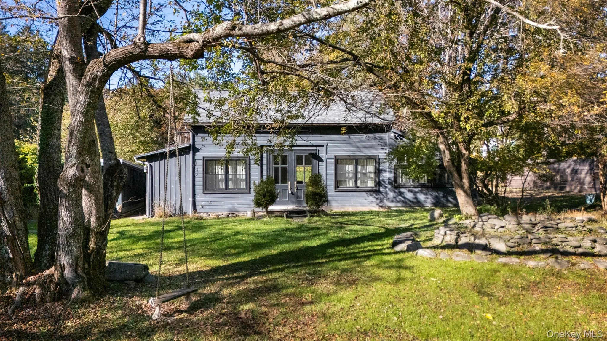 Back of house with a lawn Back of house with a lawn
