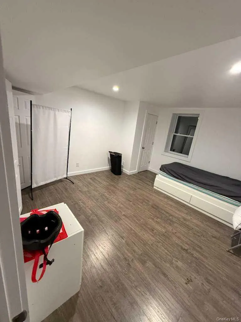 Unfurnished bedroom featuring dark wood finished floors and recessed lighting Unfurnished bedroom featuring dark wood finished floors and recessed lighting